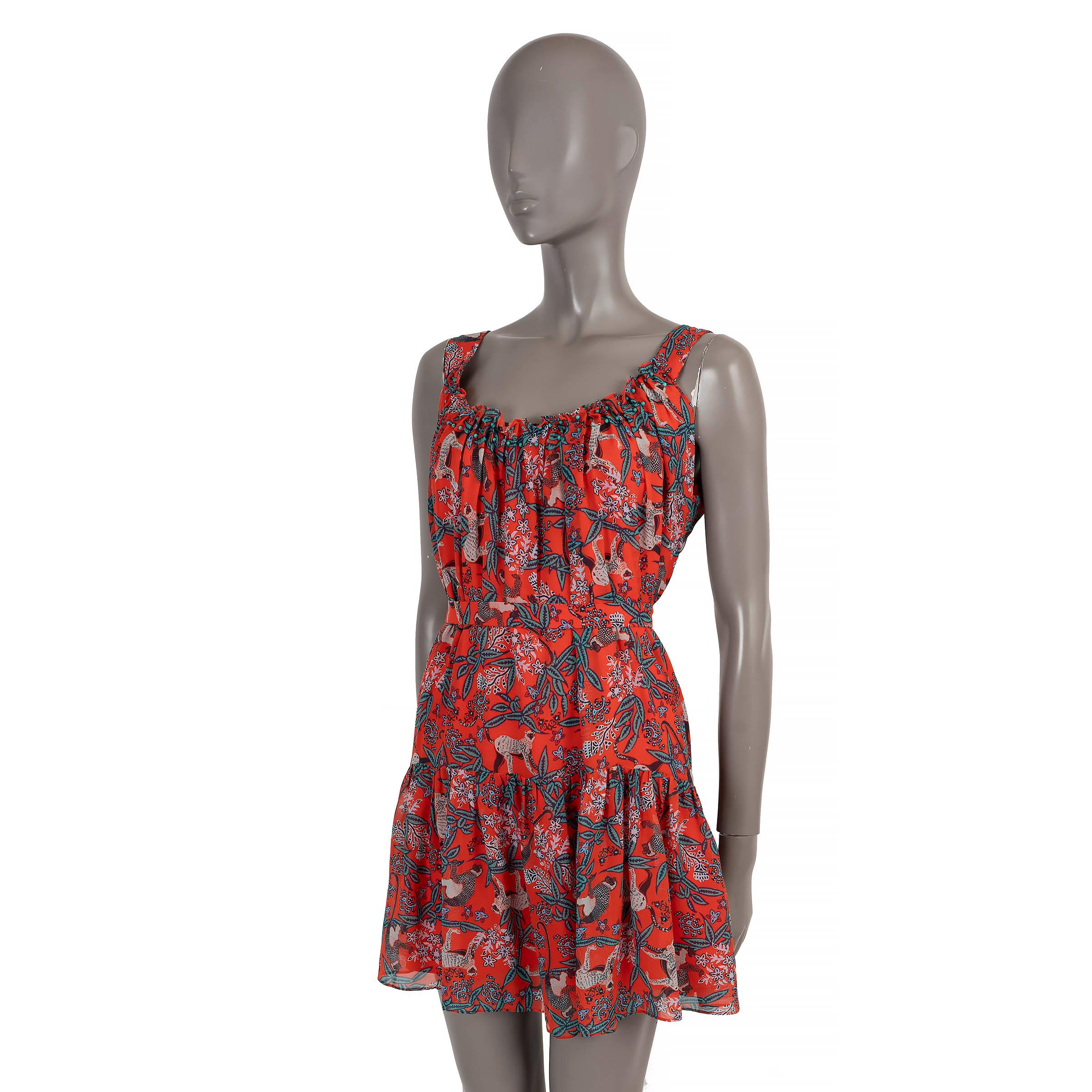 100% authentic Saloni Robyn mini dress in red georgette silk (100%) with jungle and monkey print in teal, light blue and navy. Features a ruffled round neck with turquoise bead embellishments, tiered skirt and matching belt. Opens with a buttoned