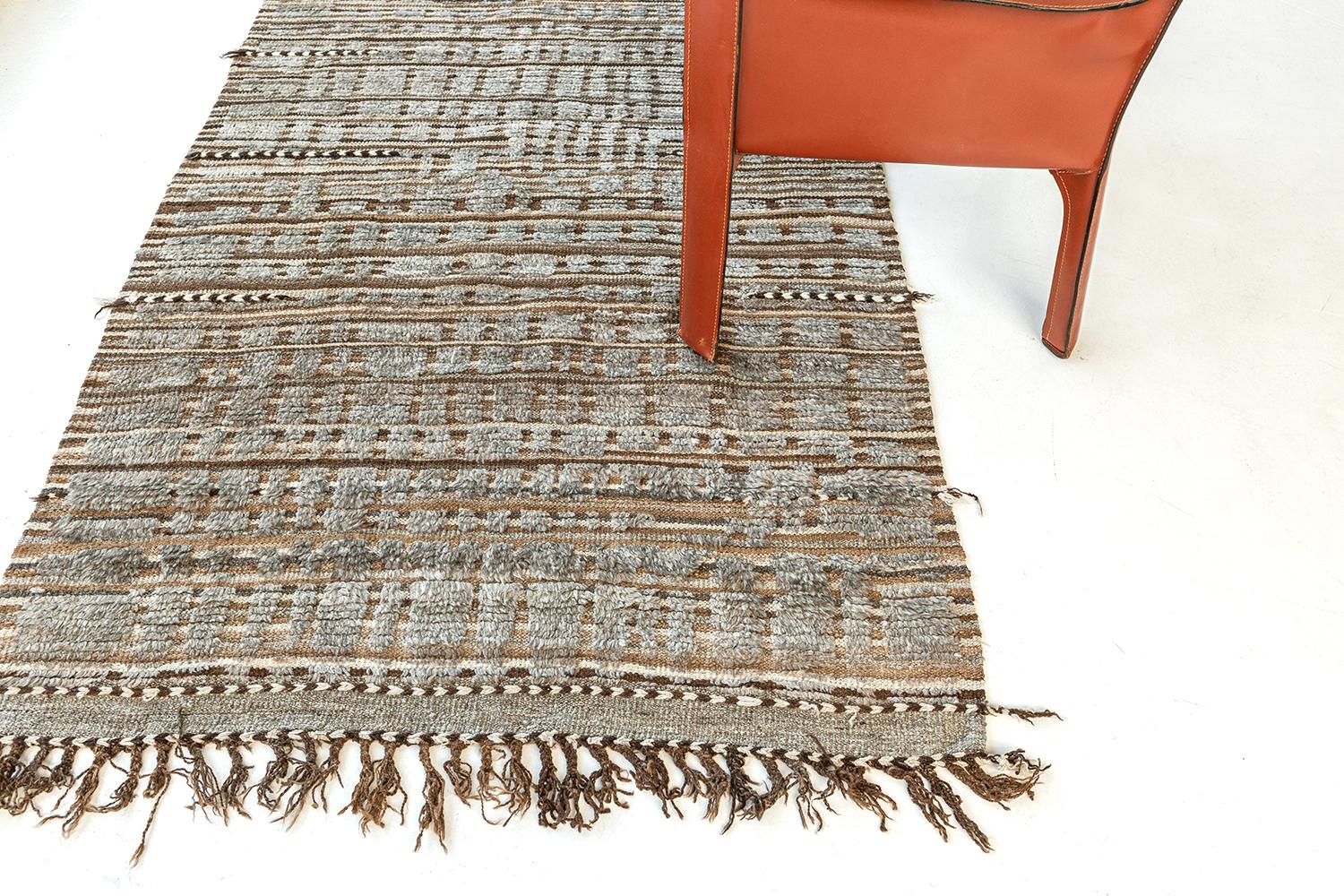 This gorgeous Salsola rug is a hand-knotted weave of embossed wool. Inspired by elements of traditional textile design from Central Asia, our Atlas Collection offers a variety of linear patterns. Common color schemes include brown and silver