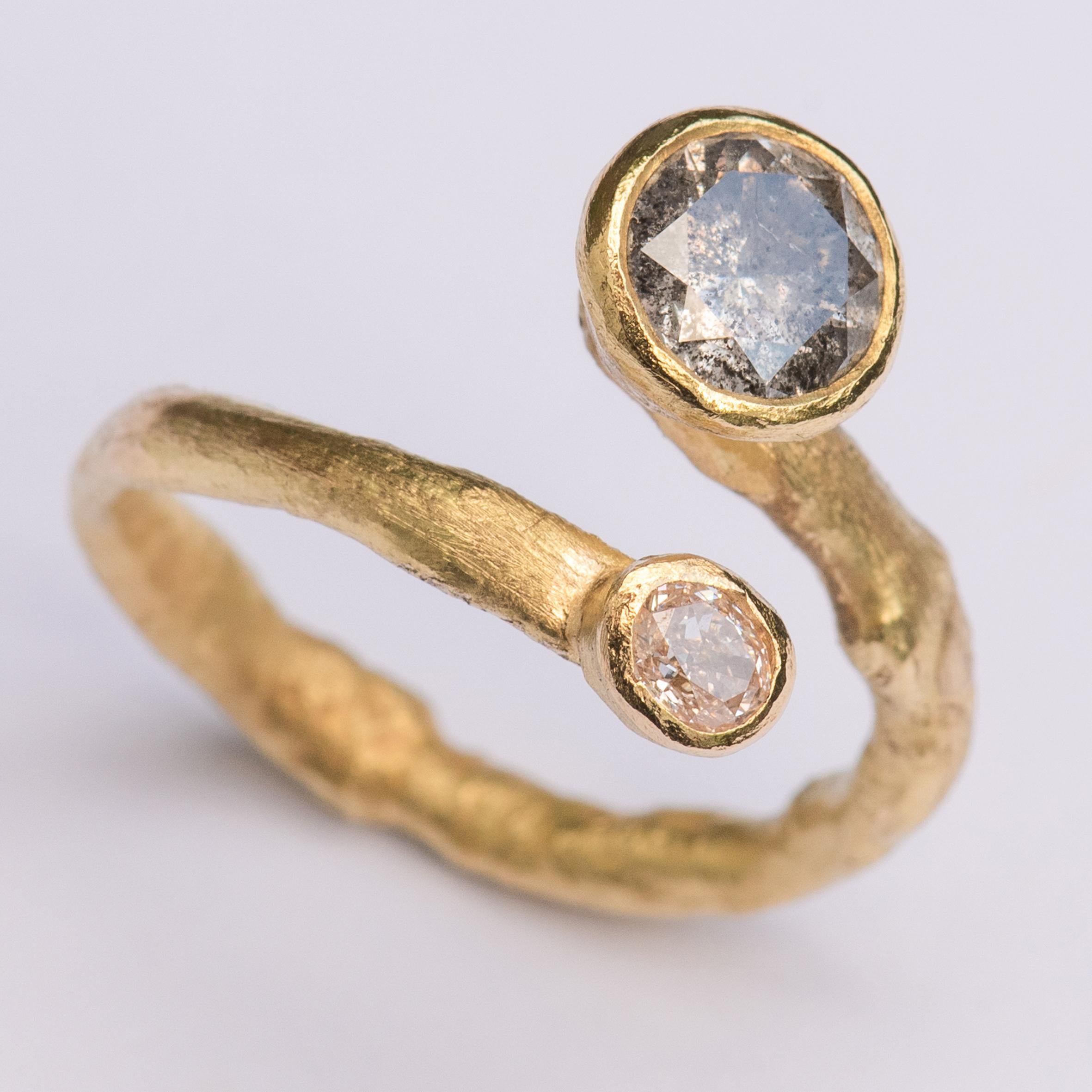 1.44 ct salt and pepper grey diamond and 0.20 ct pink diamond in 18k gold tapered settings on 18k organic texture open band.
Handmade by London Goldsmith Disa Allsopp who is inspired by ancient jewellery to create contemporary collectable pieces.