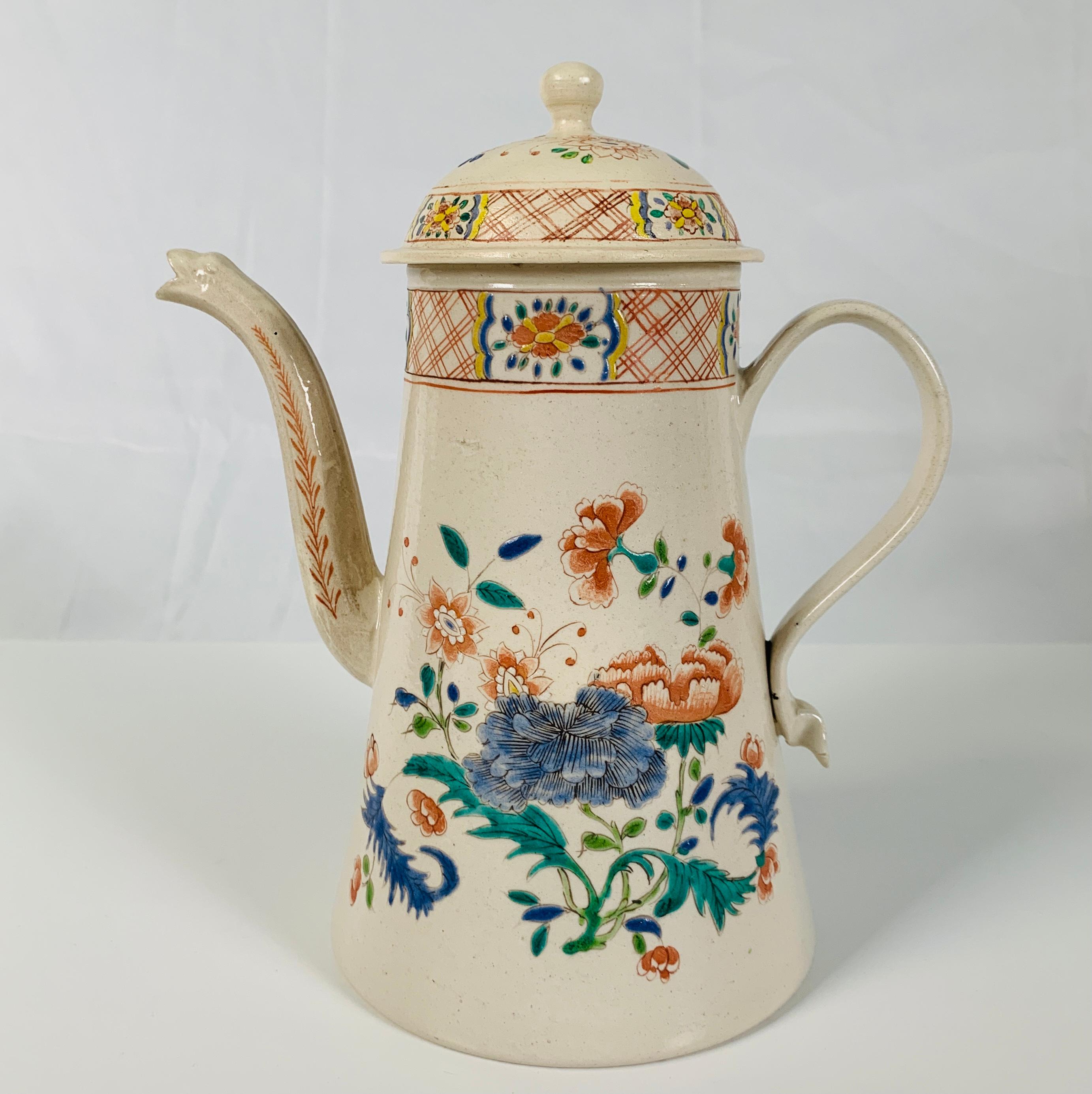 Provenance: A Private Collection; The underside of the pot has paper labels for Christie's and Matthew and Elisabeth Sharpe (See image).
Made in Staffordshire circa 1760, the pot is decorated with colorful enamels. All of the decoration on this