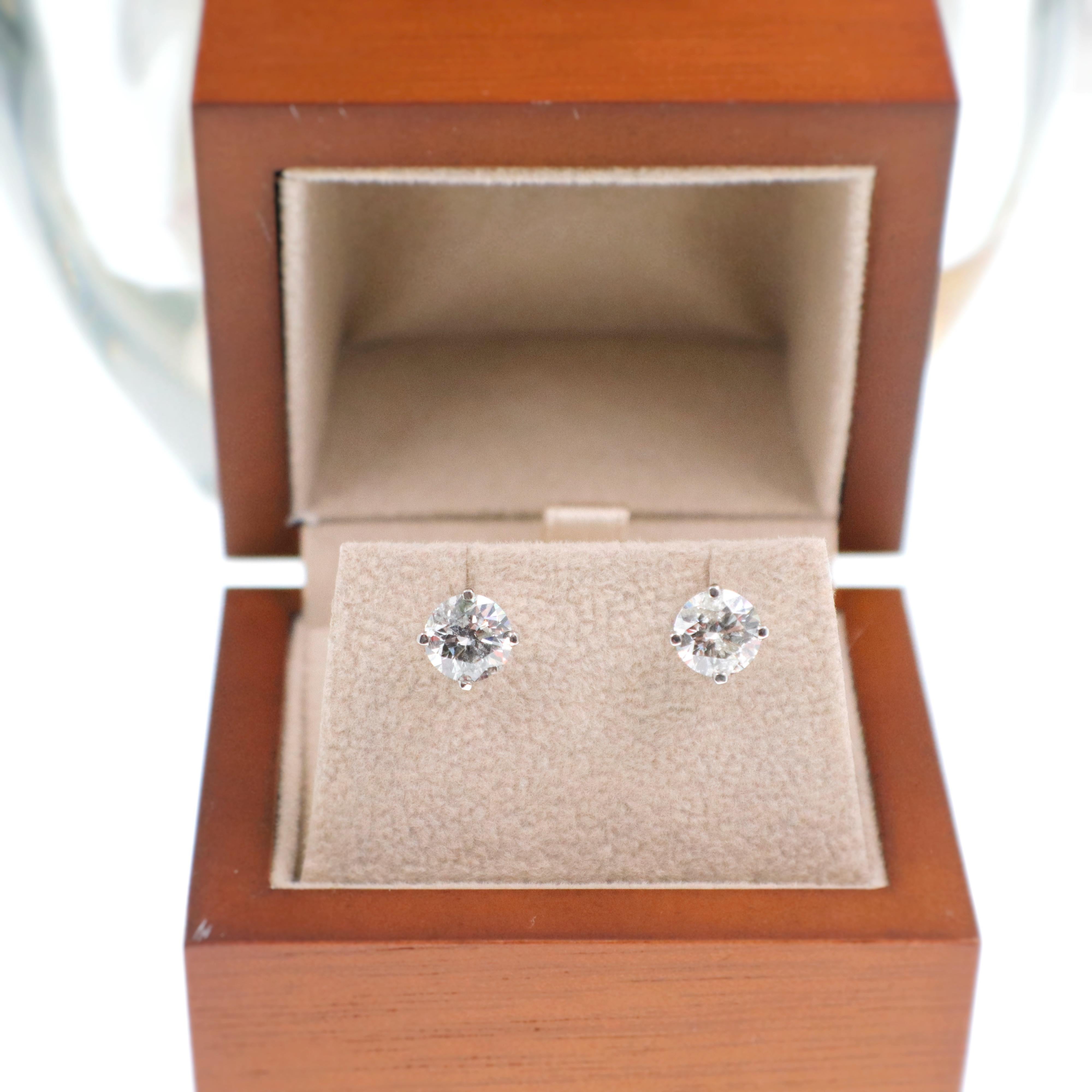 Diamond Earrings
Style:  Diamond Stud Earrings with Jumbo Friction Back Fastenings
Gold:  14K White Gold
TCW:  2.07 Carats Total
Diamond Shape:  Round Brilliant Cut
Color & Clarity:  H - I Color,  I1 Clarity
Hallmark:  14K
Includes:  Earring Box,
