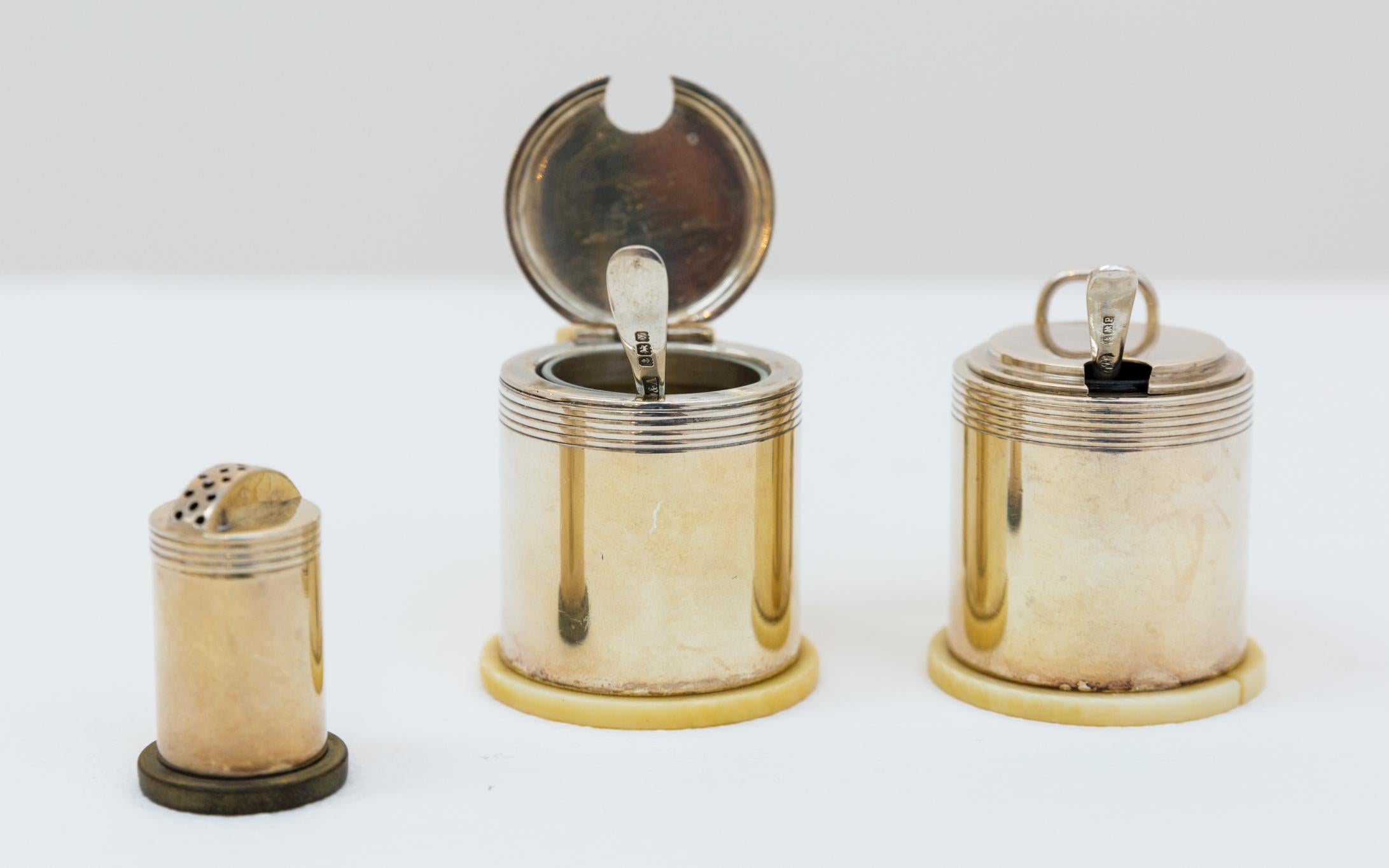Salt & Pepper set by Jean Puiforcat from 1935, Art Deco, sterling silver with bone ornament. Hallmarked 