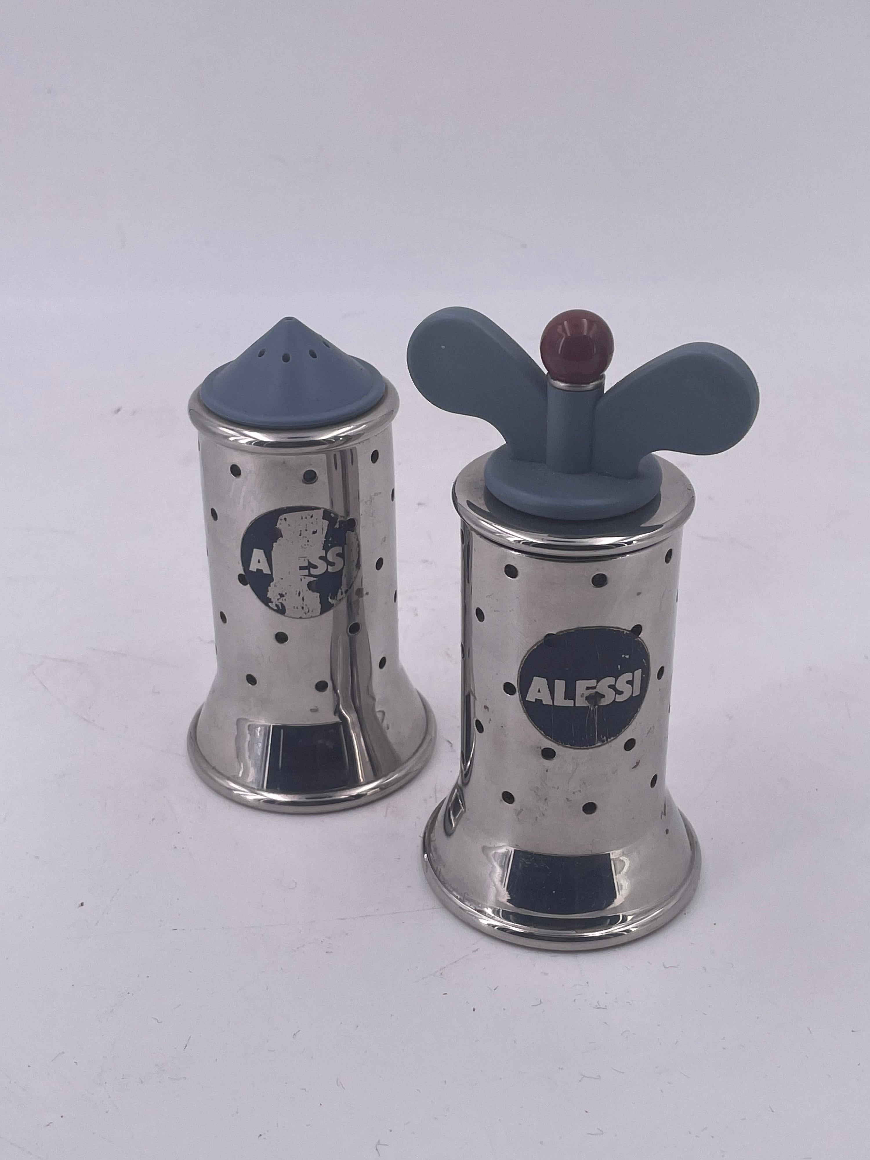 Nice pair of salt & pepper shakers designed by Michael Graves for Alessi, circa 1988 made in Italy. Memphis era Peugeot movement.