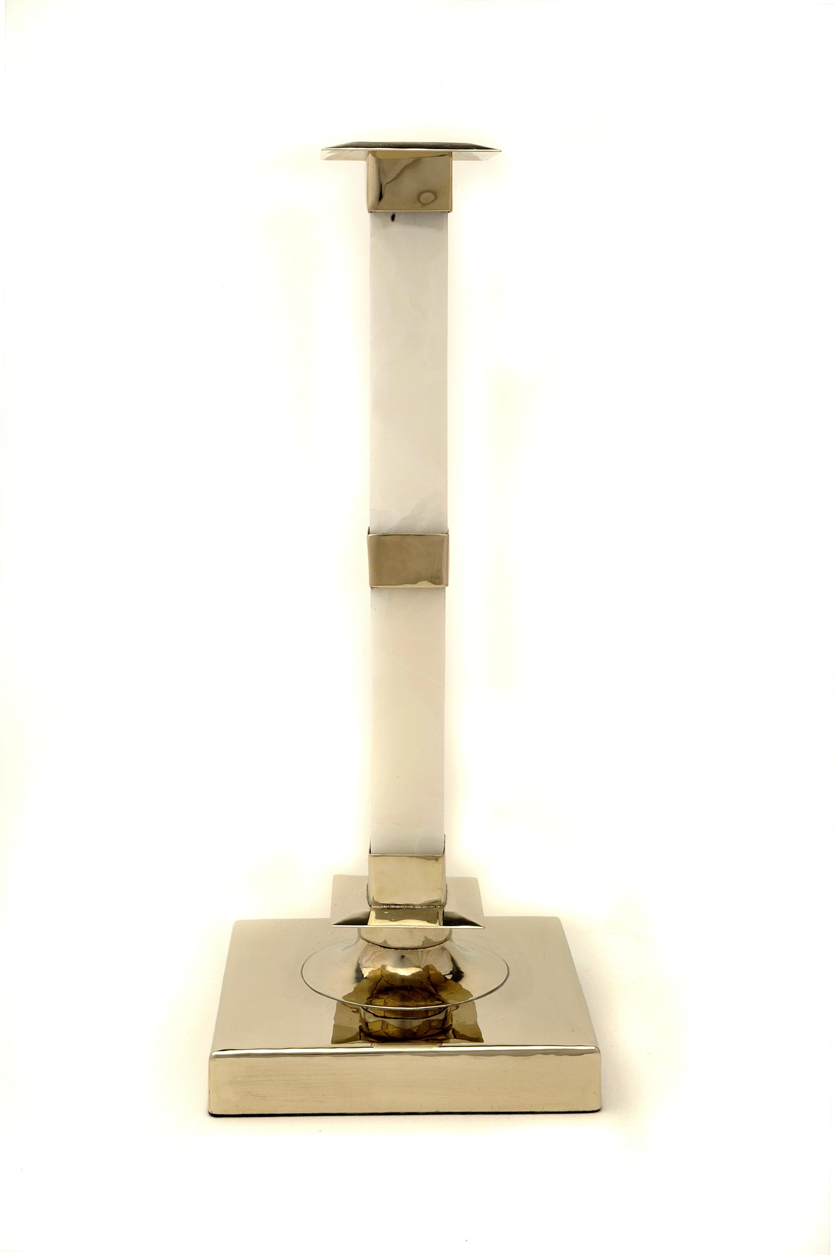 Salta Set Talls & Large Candlesticks, Alpaca Silver & Cream Onyx

Salta province is called the beautiful, and this adjective introduces us to its profound beauty. Its fertile valleys, windy desert, colorful mountains and blue sky are the images that