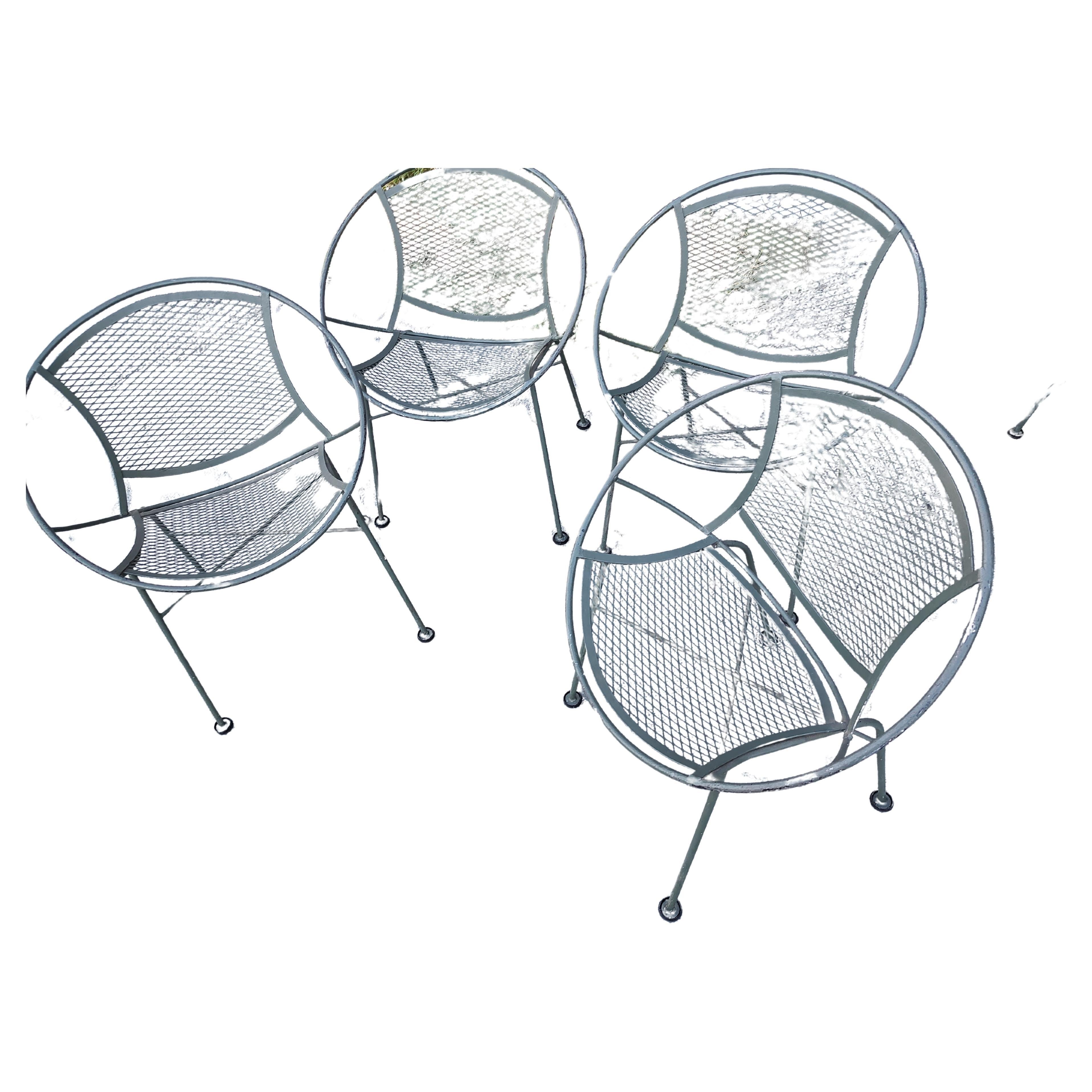 Fabulous 5 PC set which includes a 48 x 28h mesh top table with a umbrella holder. 4 iron Radar chairs with mesh seats and backs. Dims are: 25w x 20d x 30.5h x 16 seat height. All in excellent vintage condition with minimal wear. Set was well taken