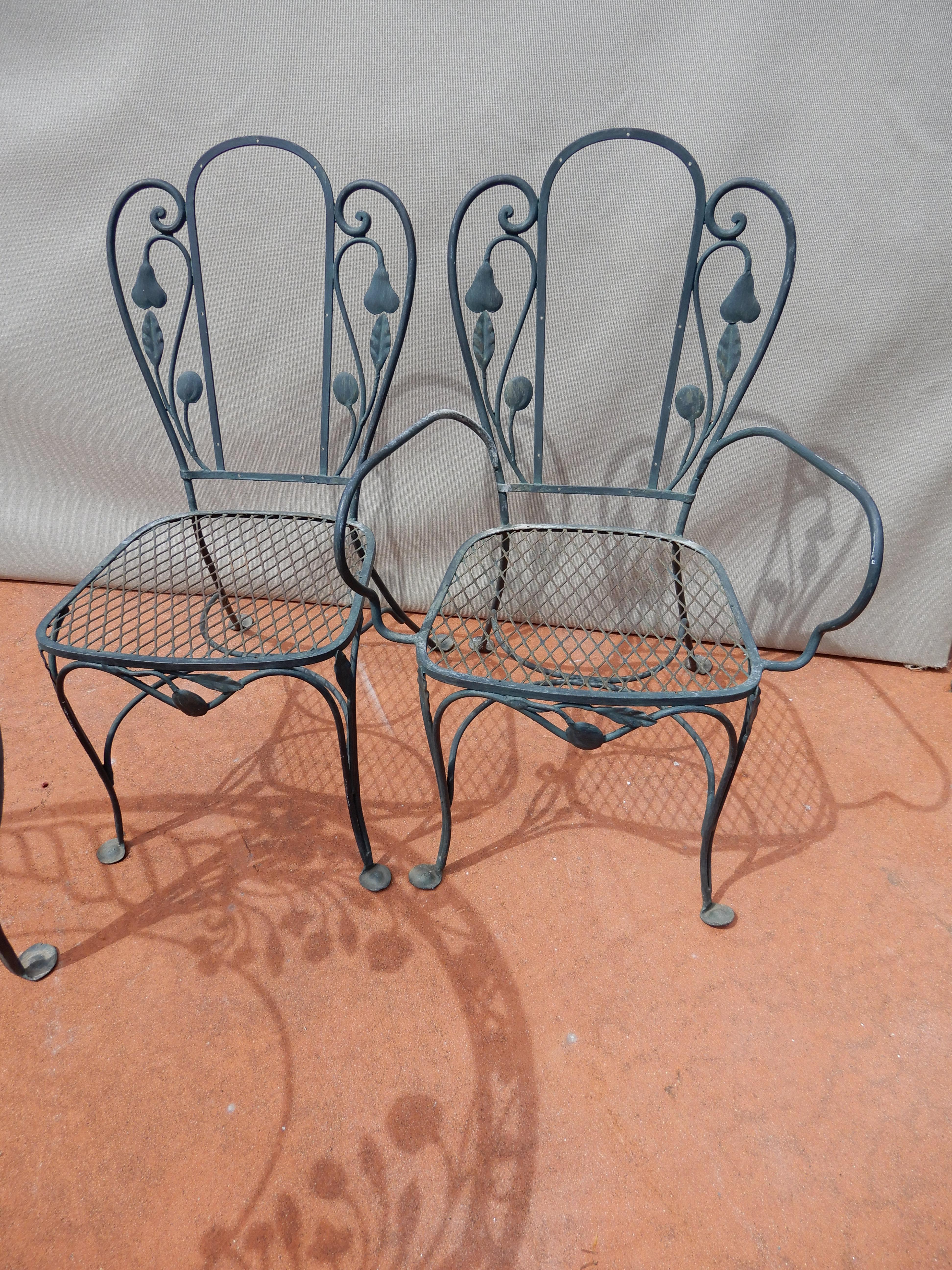 A 7-piece wrought iron Salterini Della Robbia wrought iron dining set with glass top not shown
Also, the 2nd image is from the other dining set.