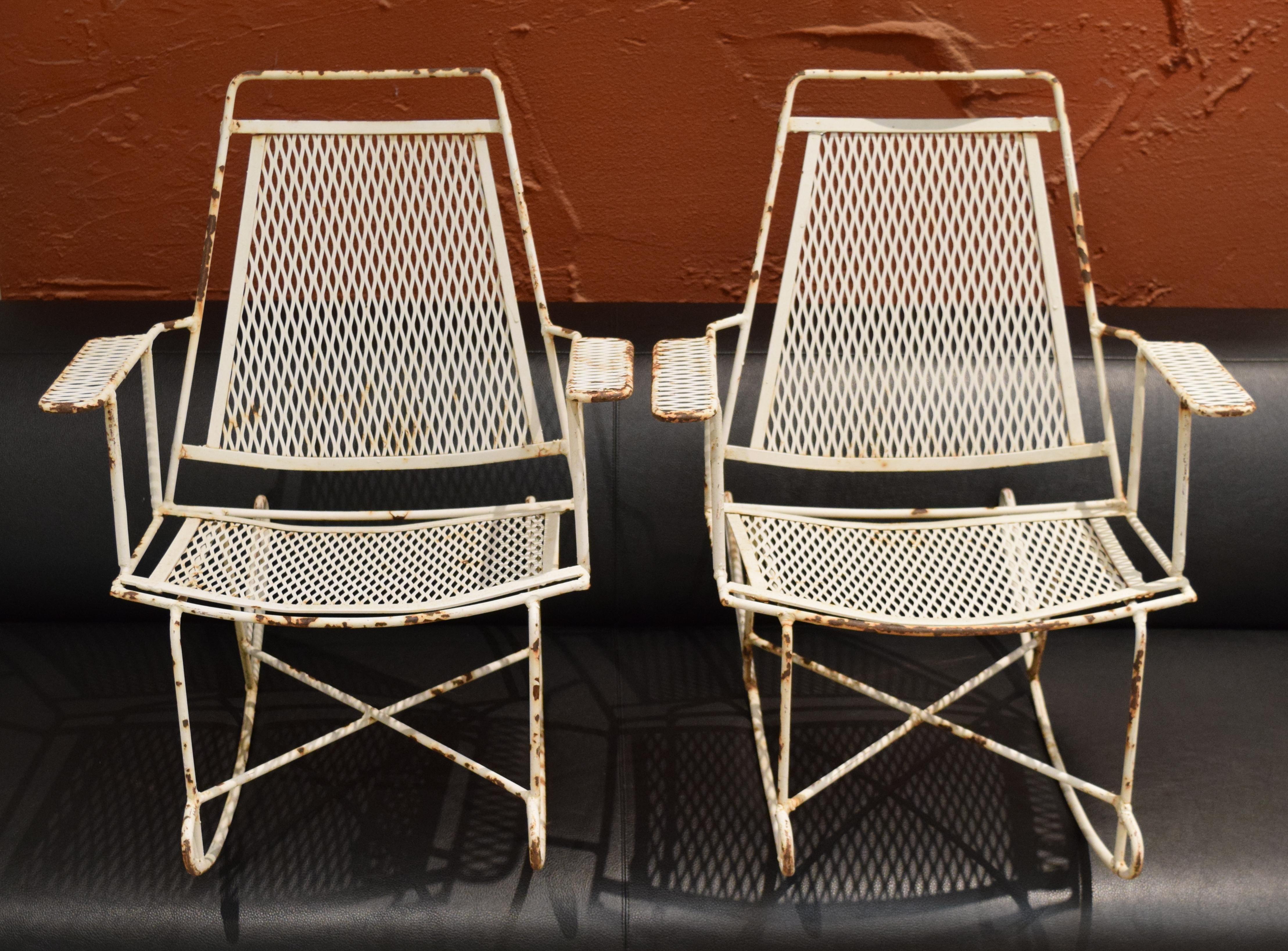 Store closing. Offers welcome! Adorable pint-sized rocking chairs in wrought iron attributed to Salterini. Eight chairs (these two small plus six large) currently in inventory. Full-sized reproductions by Dimorestudio currently selling for