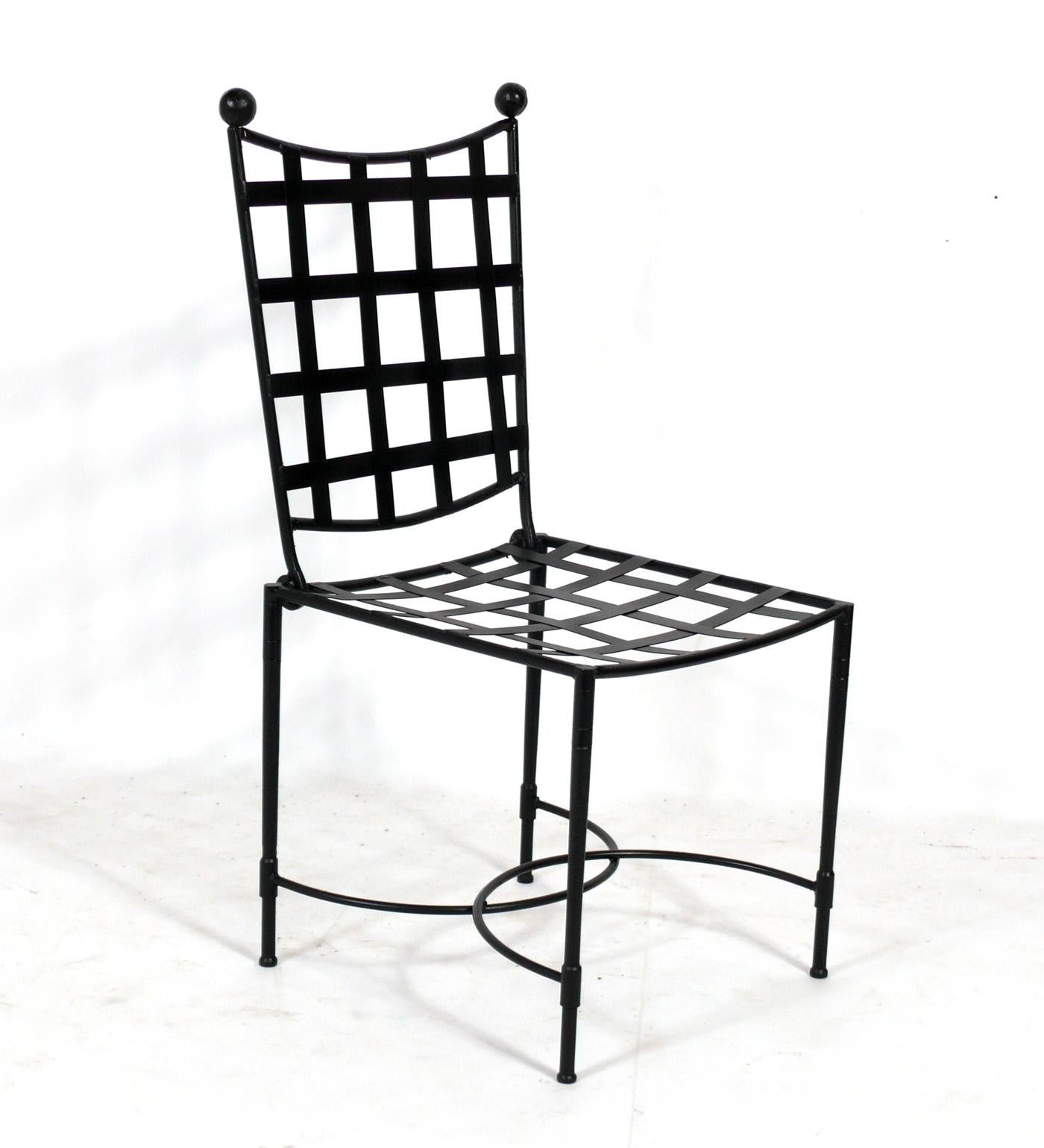 Set of Four Sculptural Iron Dining Chairs, design attributed to Mario Papperzini, and made by Salterini, American, circa 1960s. They can be used indoors or outdoors and have been repainted and are ready to use.