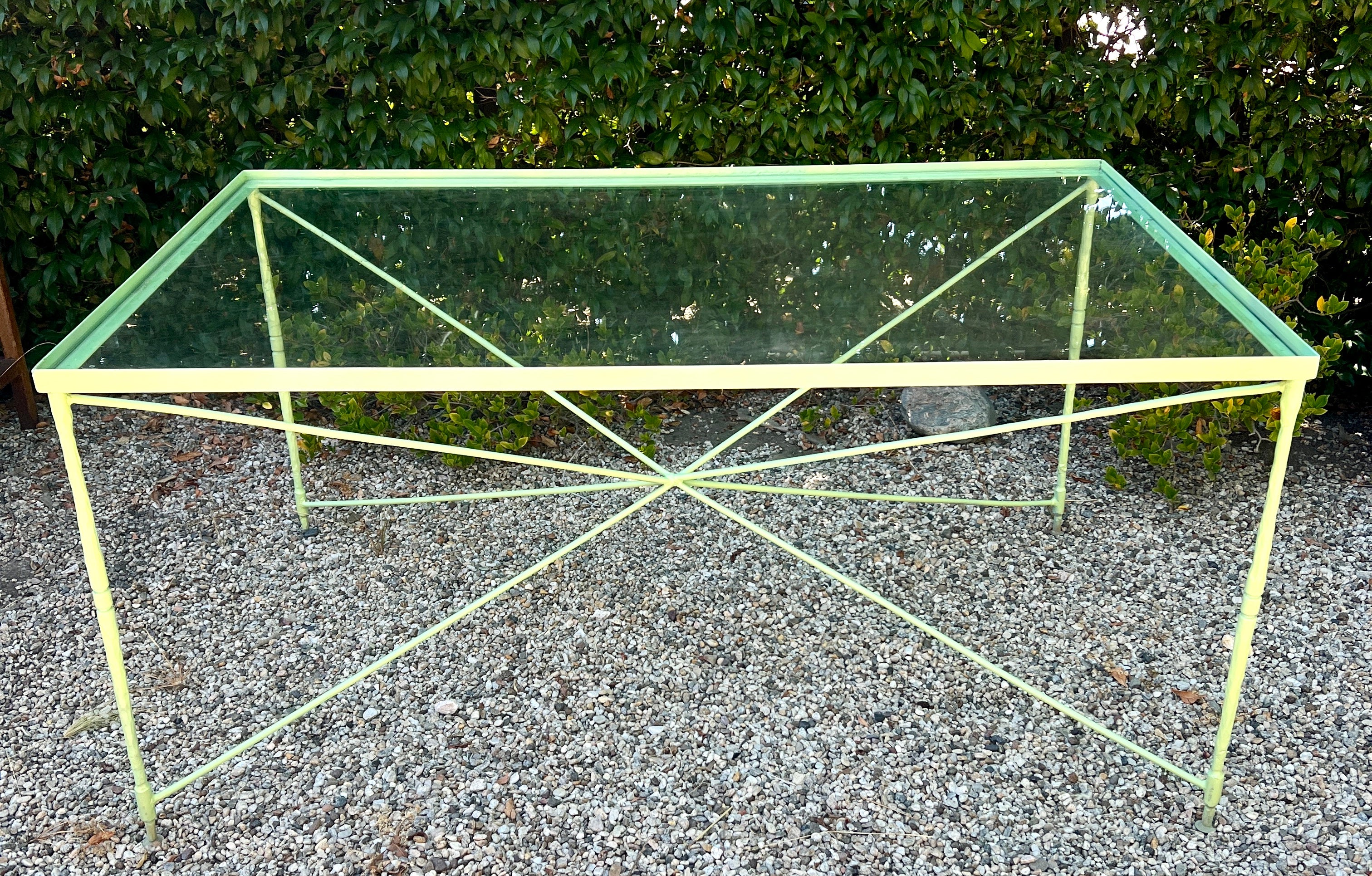 A beautifully hand crafted Wrought Iron dining table by designer / manufacturer, Salterini.

The table is hand Welded and hammered with the signature leg and truss, all representing the same style and techniques as the chairs and chaise lounges that