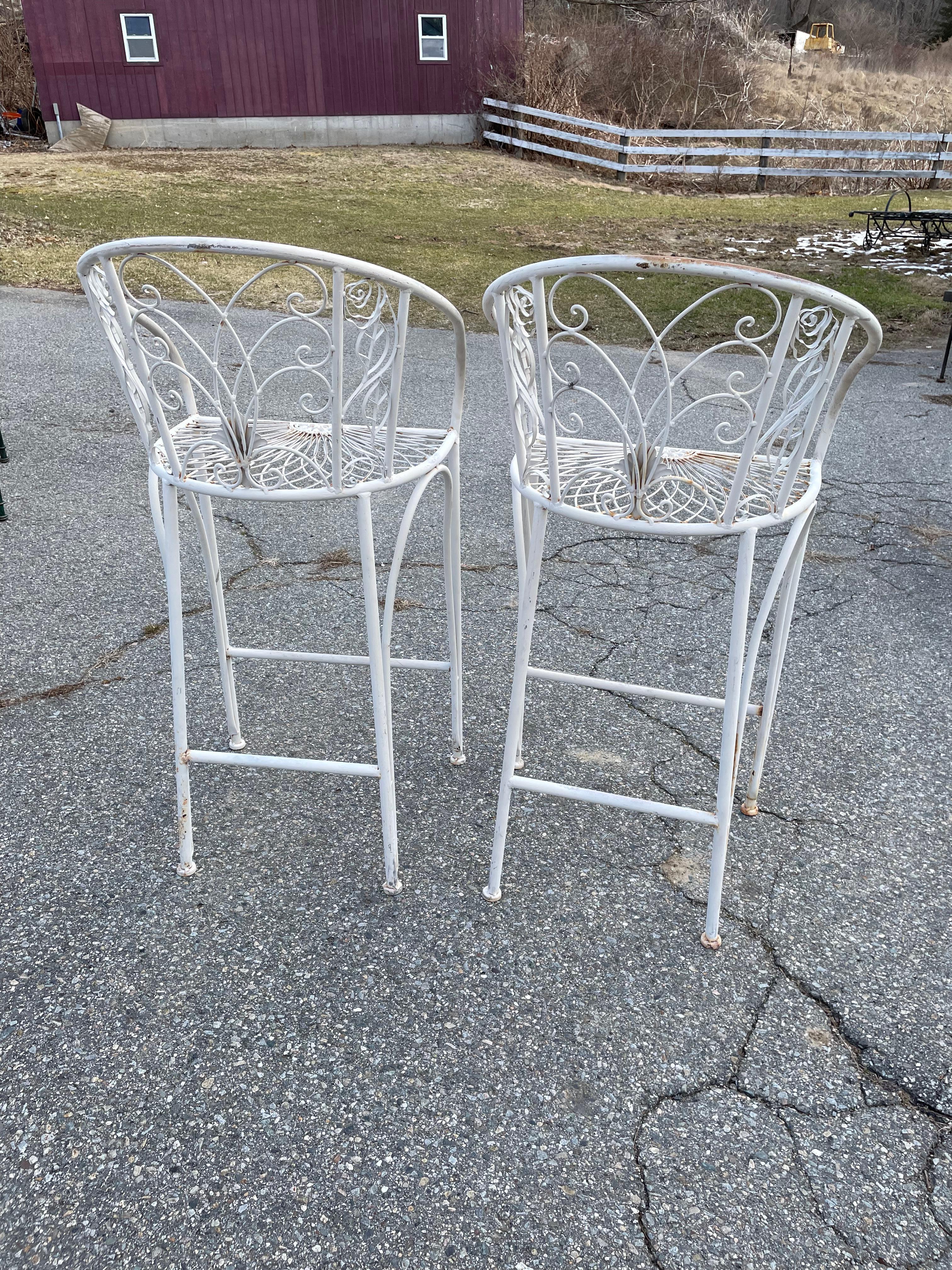 Salterini Wrought Iron Seating
For your consideration is a beautiful pair of bar stools with ornate rose and leaf detailing. Scrolled back rest and seat with detailed medallion centered in the middle with an ivory finish. Pair it perfectly with the