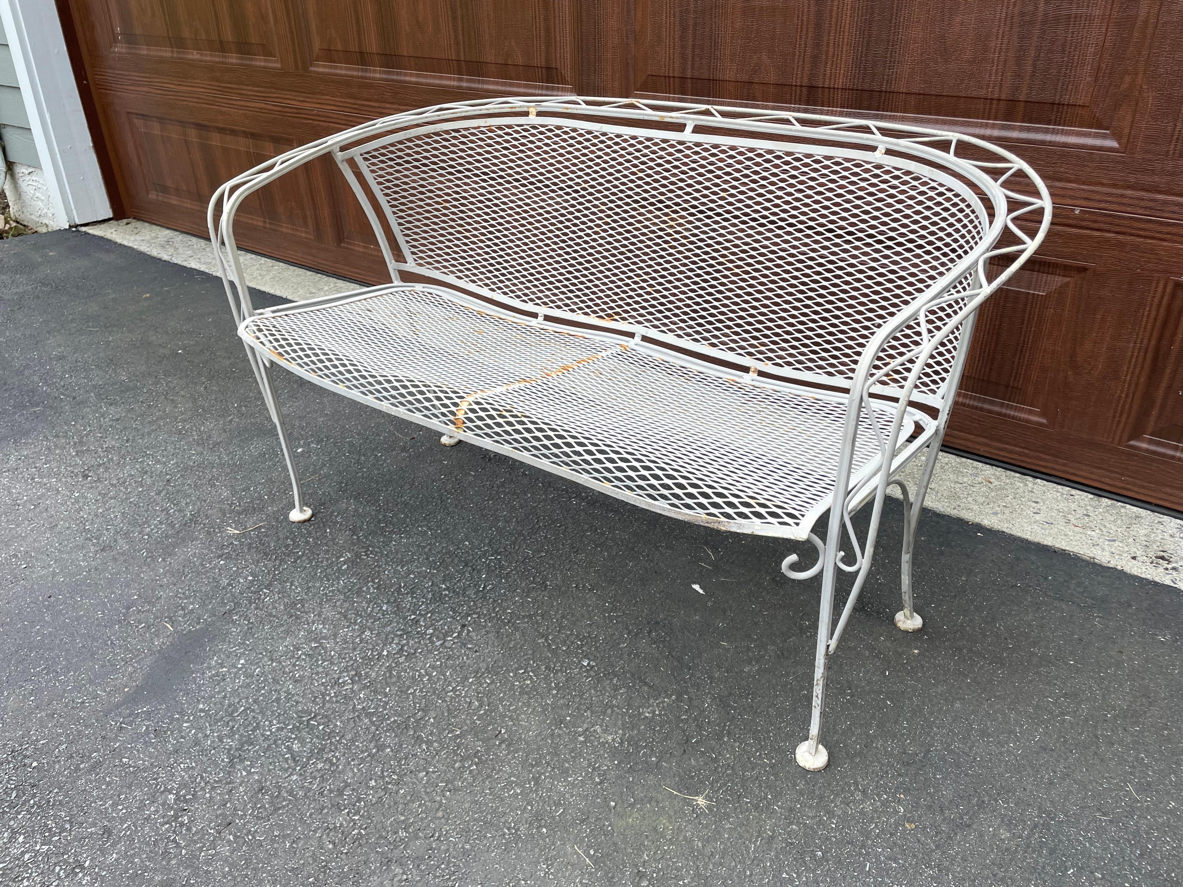 Salterini zig zag painted settee. Great lines, solid piece. Age appropriate surface wear including chipped paint and rust but not affecting use or structural soundness. Great scale for a city terrace!