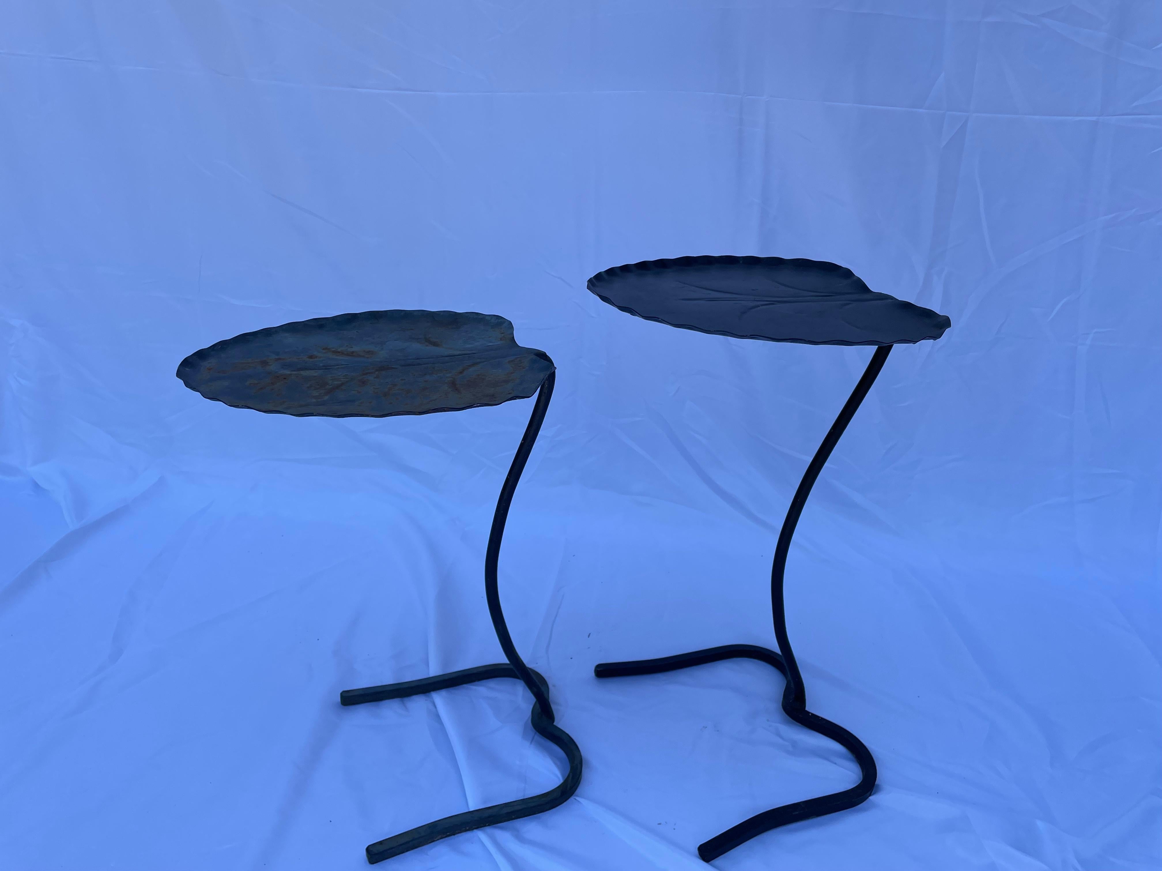 Classic pair of Salterini nesting leaf tables in black. Curiously, the smaller/lower table shows the most weathering (which may suggest that these were separated or are a married pair). Wonderful and useful collector's item!