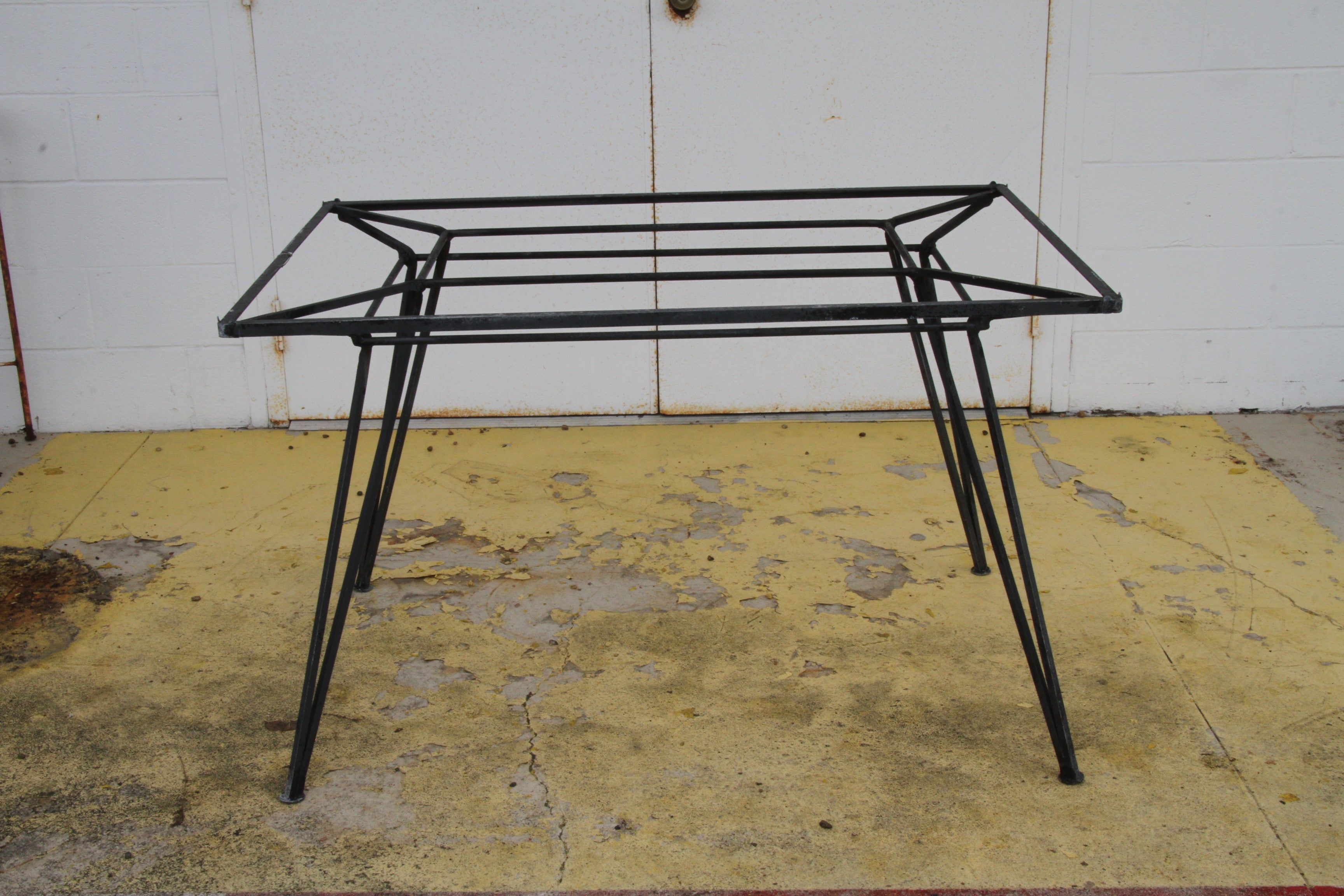 Salterini Style midcentury Wrought Iron Table

Rare wrought iron table attributed to Salterini. Structurally sound and sturdy. Could be used indoor or outdoor.
The table is being offered without the glass insert top.

48