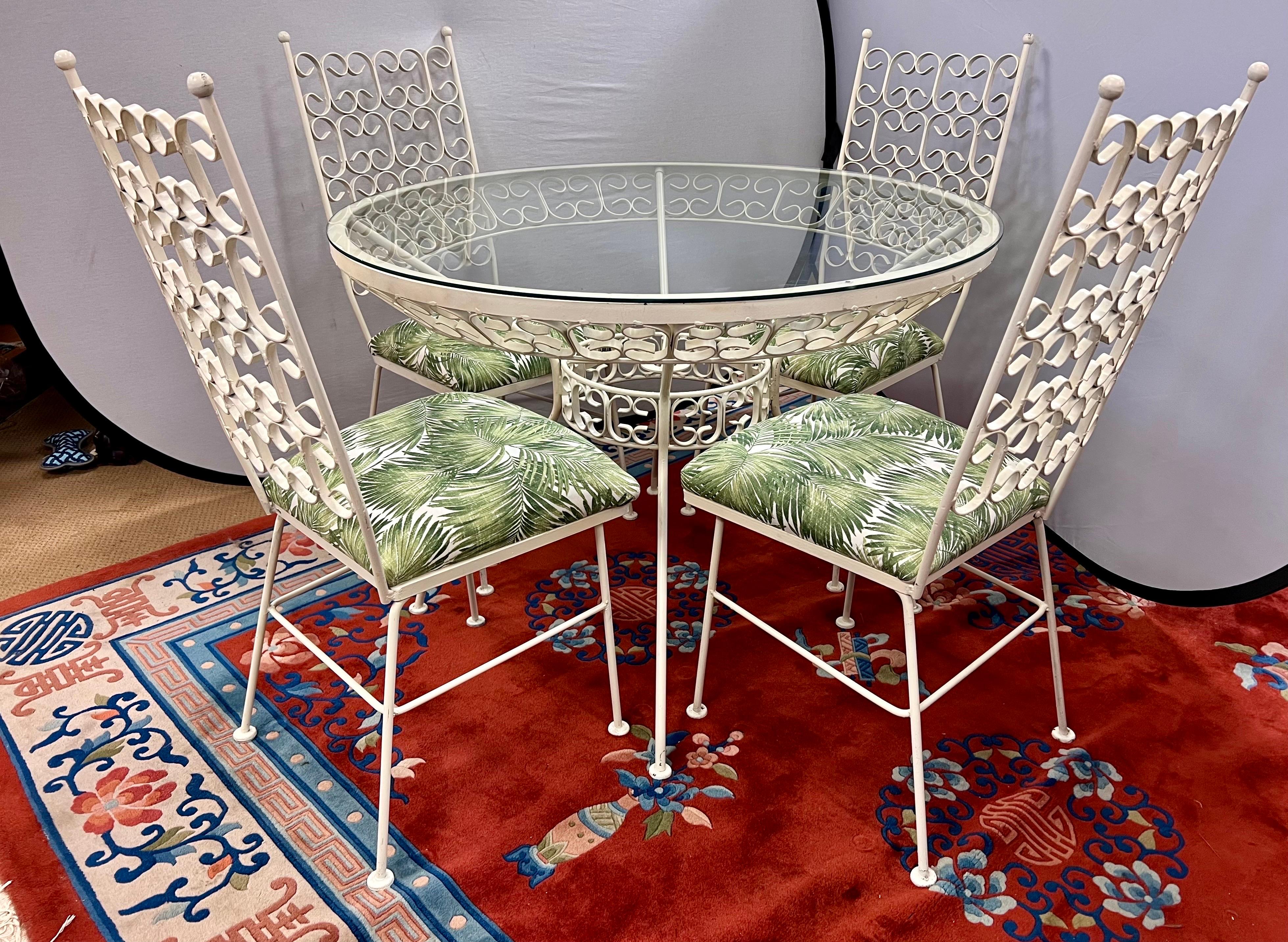 Vintage Arthur Umanoff Grenada dining set - this set has been powder coated white and the seat cushions have been completely reupholstered with a tropical print fabric. Very Palm Beach regency.
Fabulous 5-piece dining set includes 4 high back chairs