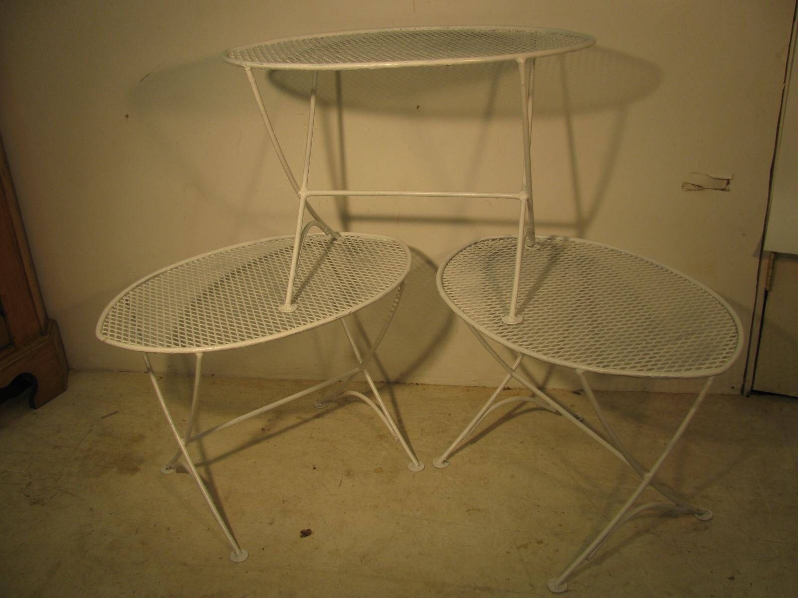 Set of 3 stylized oval side tables by Maurizio Tempestini for John Salterini. Curved legs with ample space for your drink and food plate. Just recently painted white. See the other pieces from this set in other listings. Set of six chairs with