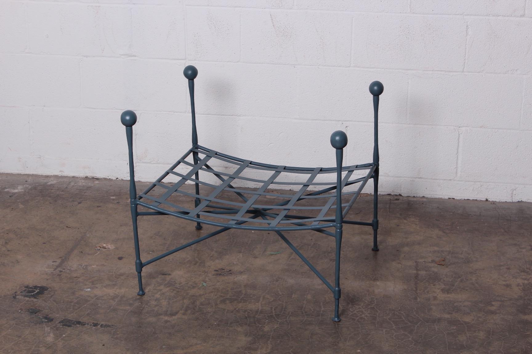 A Salterini sculptural iron lattice top ottoman with corner posts. Newly powder coated.