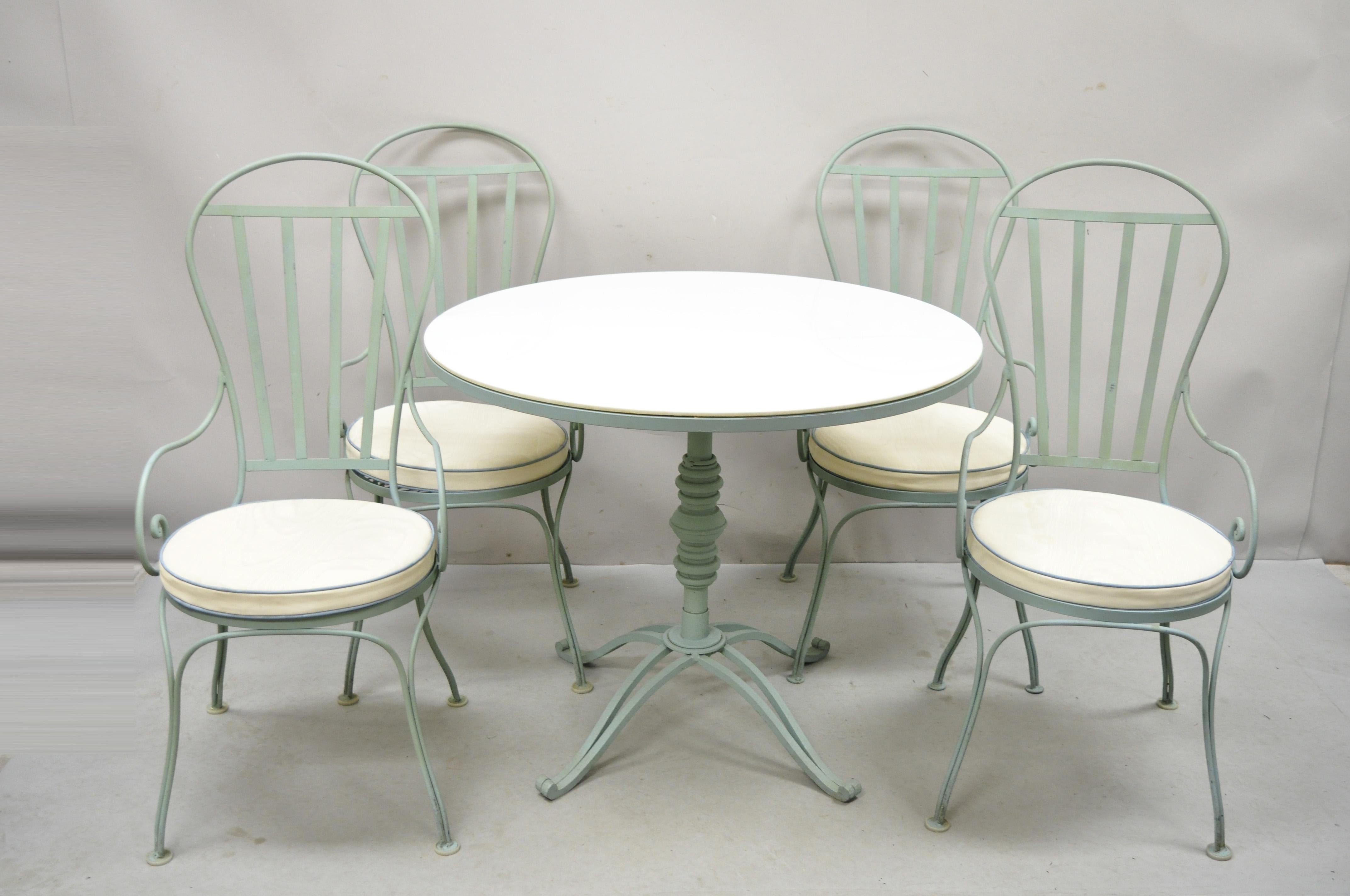 Vintage Italian Salterini Style Wrought Iron Scrolling Dining Set French Bistro Table - 5 pc Set. Item features 4 arm chairs, 1 round table with vitrolite milk glass top, iron French pastry bistro style pedestal base, very nice vintage set, quality
