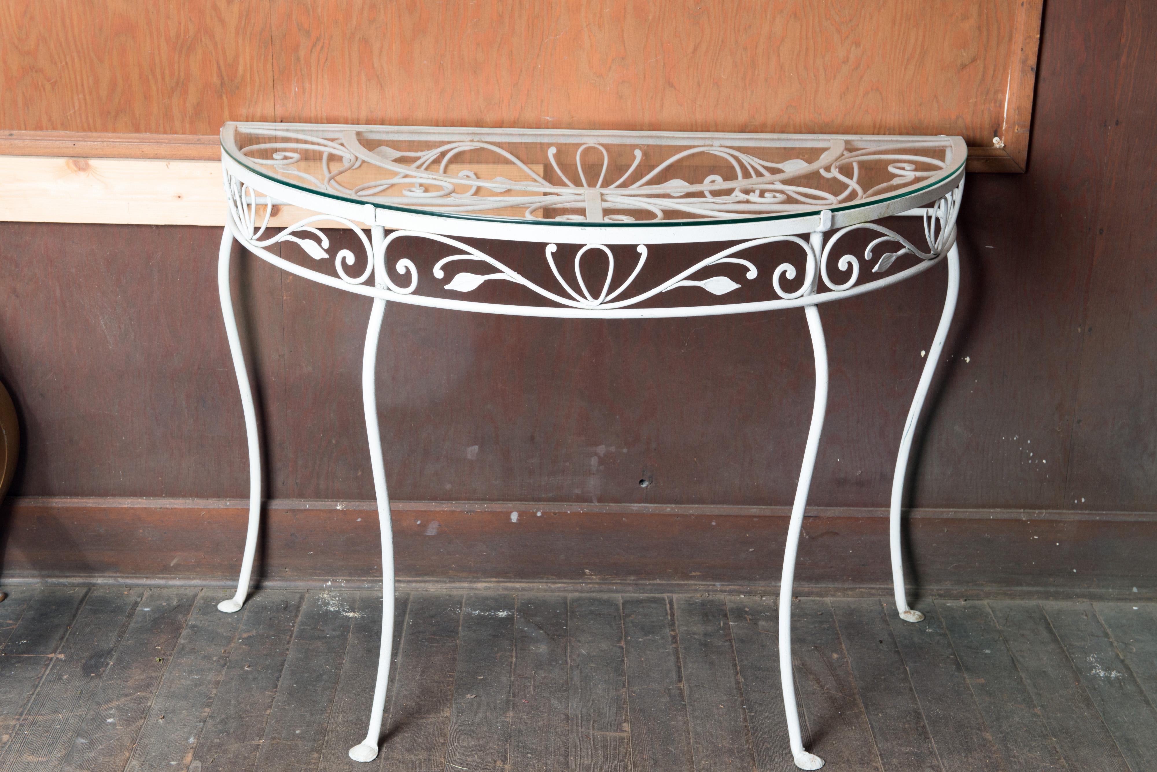 1940s fine quality wrought iron Salterini demi lune console table with glass top. Salterini was consider the best quality wrought iron garden furniture of the time.