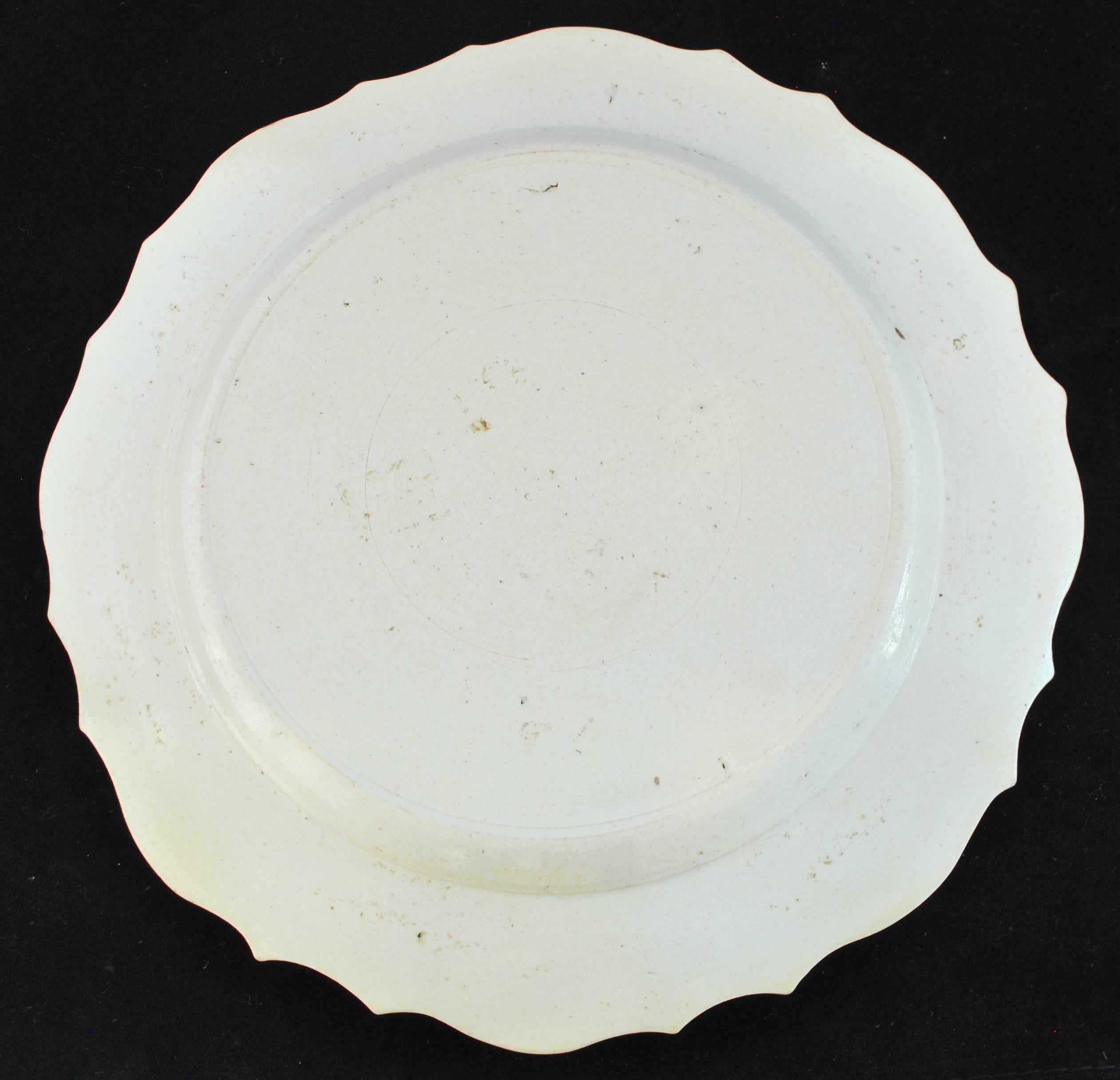 A salt-glaze plate, probably made about the time of Frederick the Great's successes in the Seven Years War and his convention with England in 1756 against France and her Allies.

     