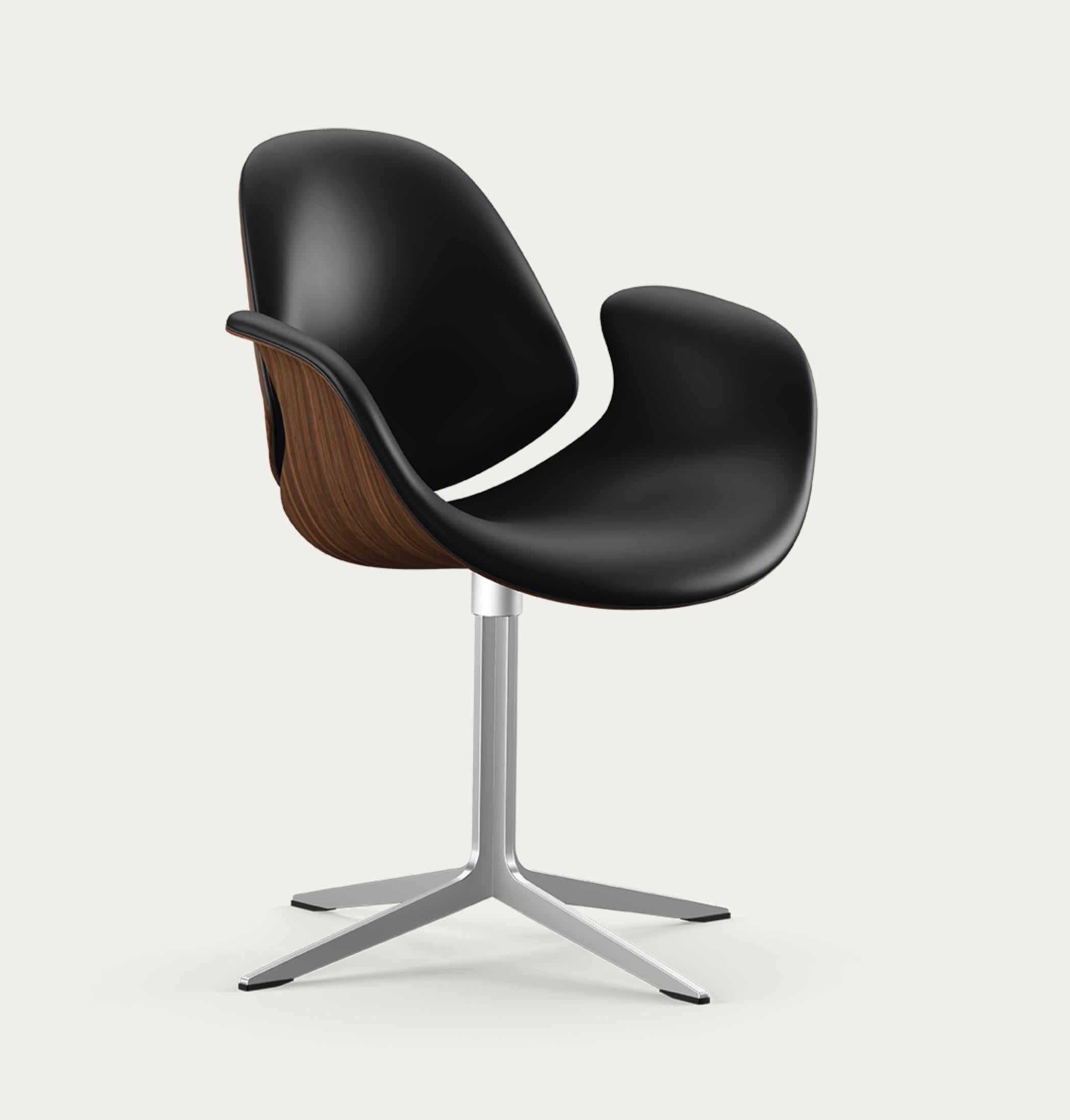 Salto and Sigsgaard Council Chair Wood Types: Walnut,  Upholstery: Nevada Leather Black For One Collection.

The Council Chair, designed in 2011 by Kasper Salto & Thomas Sigsgaard, was specifically designed for the Trusteeship Council Chamber at the
