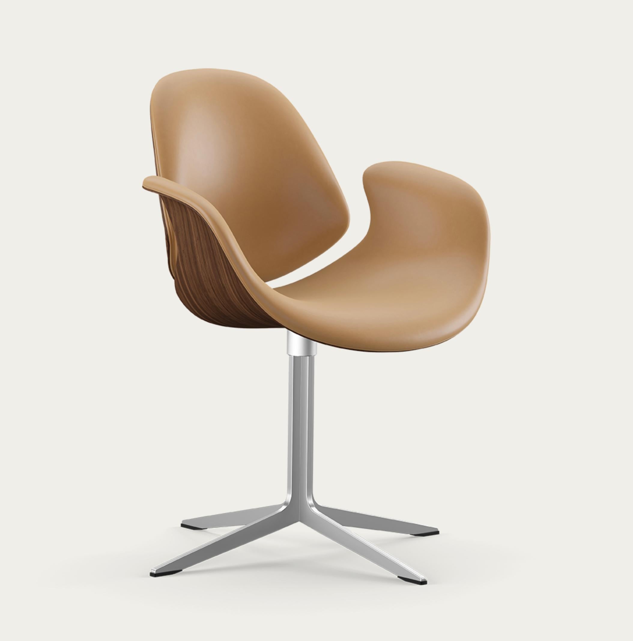 Salto and Sigsgaard Council Chair Wood Types: Walnut,  Upholstery: Nevada Leather Sand For One Collection.

The Council Chair, designed in 2011 by Kasper Salto & Thomas Sigsgaard, was specifically designed for the Trusteeship Council Chamber at the