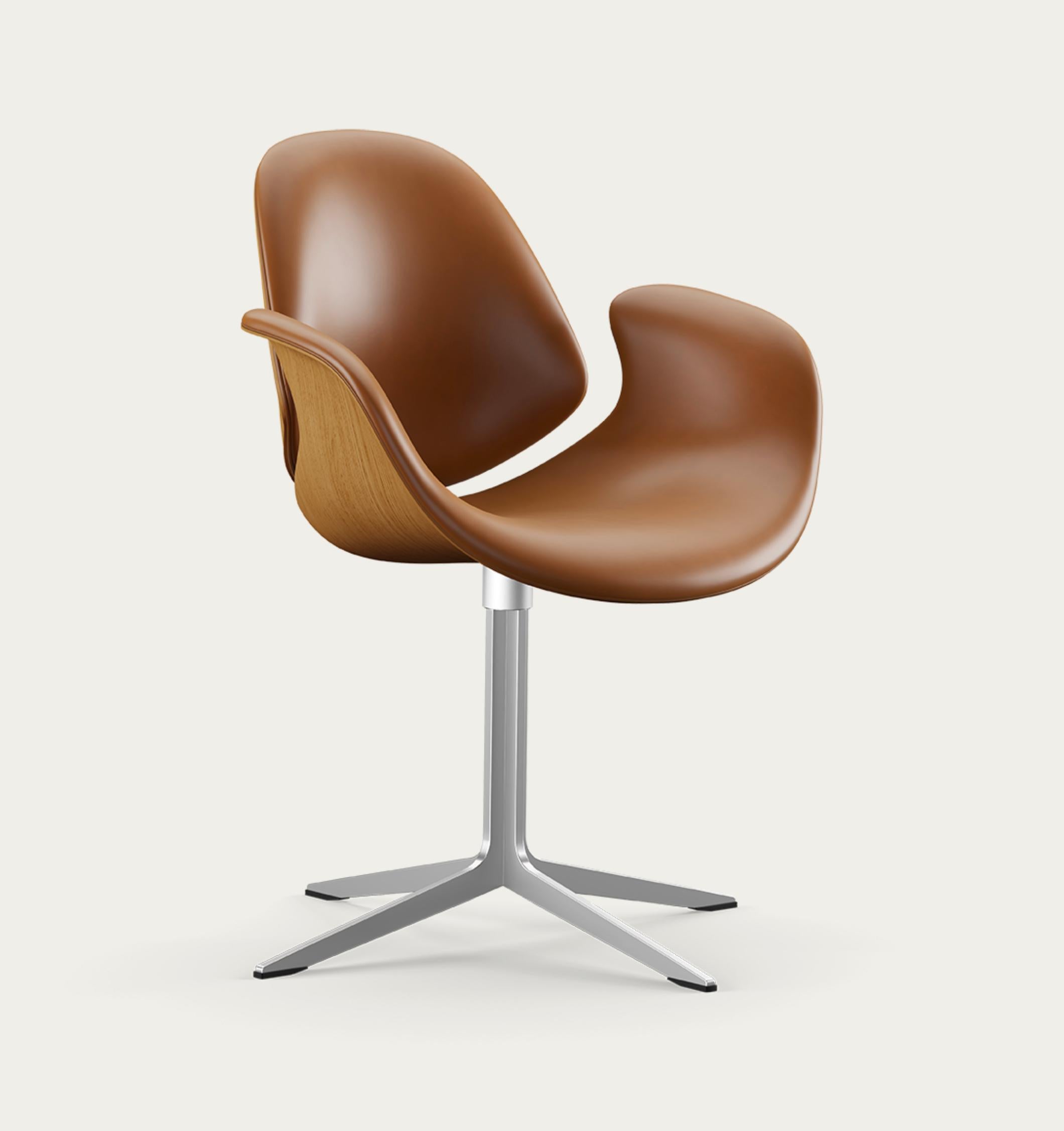 Salto and Sigsgaard Council Chair Wood Types: Oak,  Upholstery: Nevada Leather Cognac For One Collection.

The Council Chair, designed in 2011 by Kasper Salto & Thomas Sigsgaard, was specifically designed for the Trusteeship Council Chamber at the