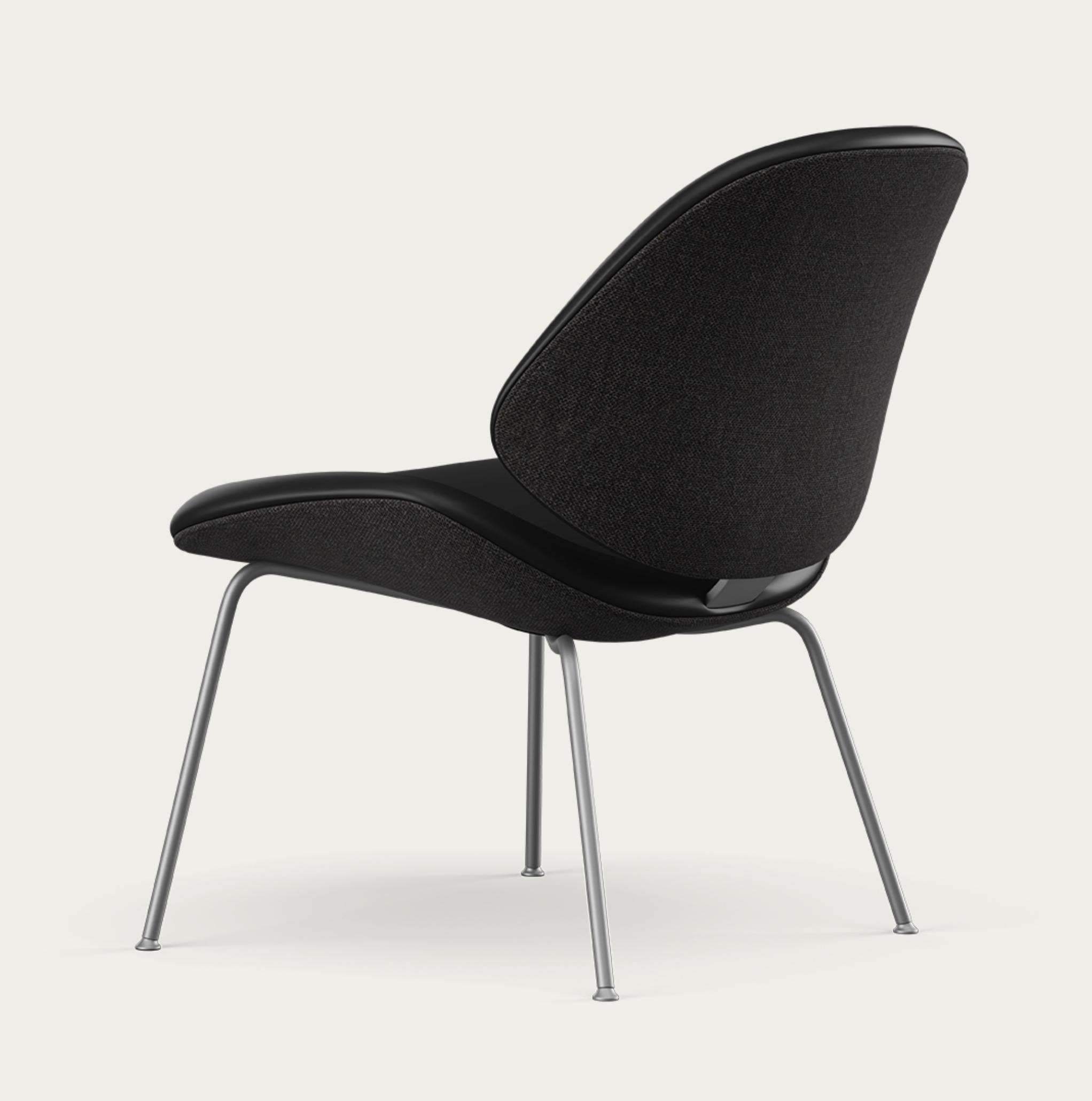 Salto and Sigsgaard Council Family Lounge Chair Legs: Graphite Duo Upholstery: Front: Nevada Black + Back: Re-wool 198 For One Collection 

The Council Family Lounge Chair is the ideal seating option for relaxed furnishing, whether in a professional