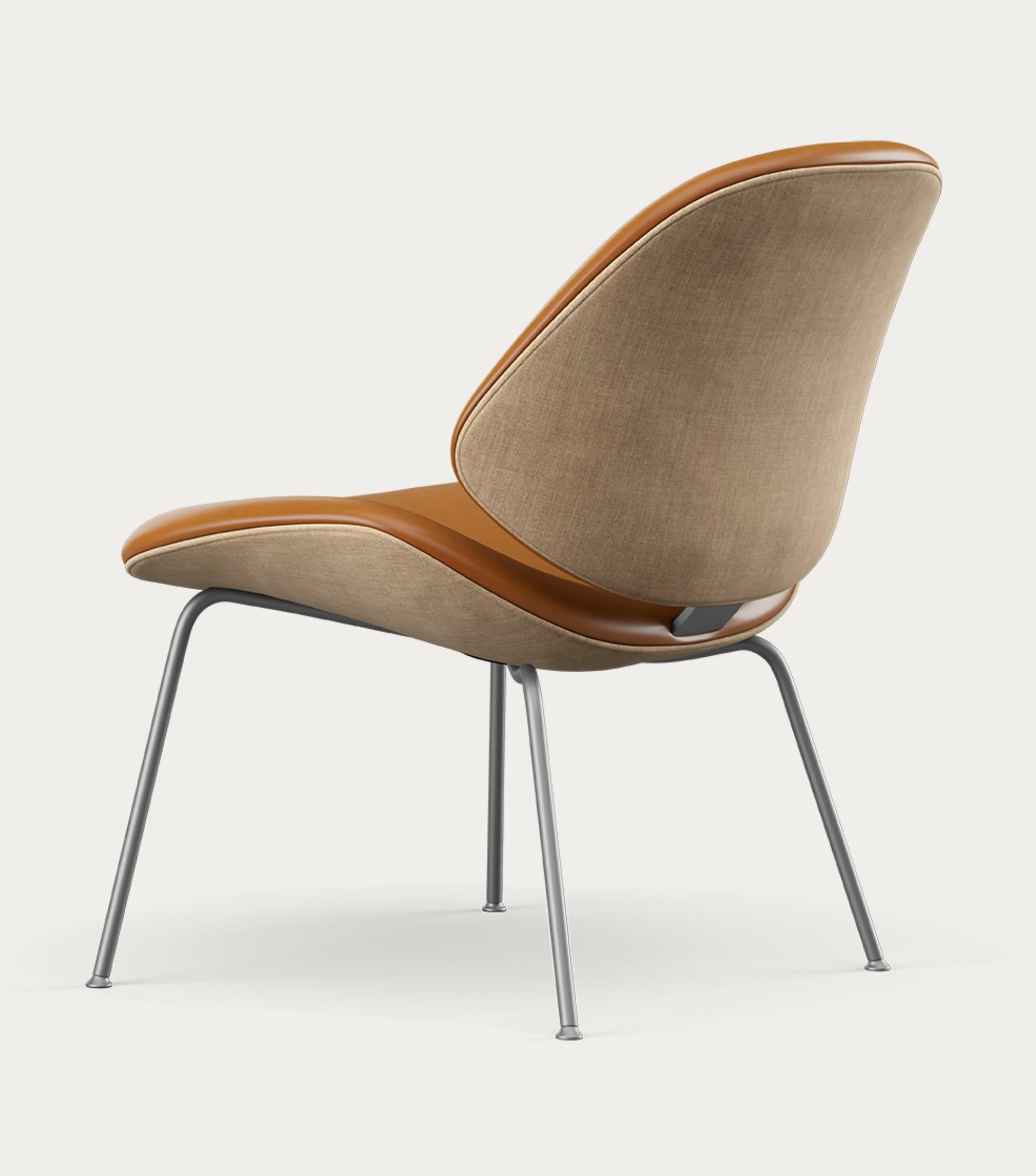 Salto and Sigsgaard Council Family Lounge Chair Legs: Graphite Duo Upholstery: Front: Nevada Cognac + Back: Remix 242 For One Collection 

The Council Family Lounge Chair is the ideal seating option for relaxed furnishing, whether in a professional