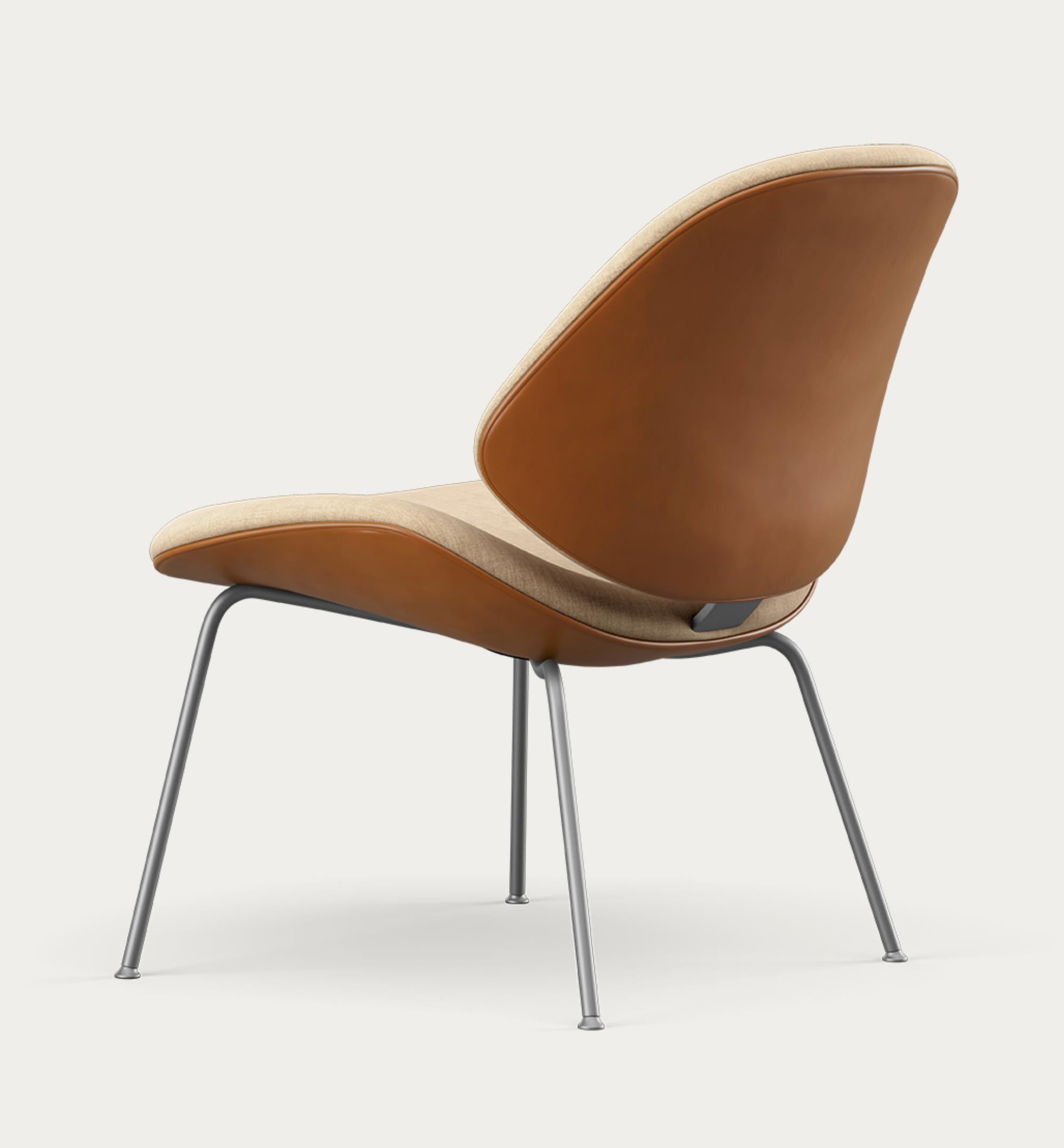 Salto and Sigsgaard Council Family Lounge Chair Legs: Chrome, Duo Upholstery:Front: Remix 242 + Back: Nevada Cognac  For One Collection 

The Council Family Lounge Chair is the ideal seating option for relaxed furnishing, whether in a professional
