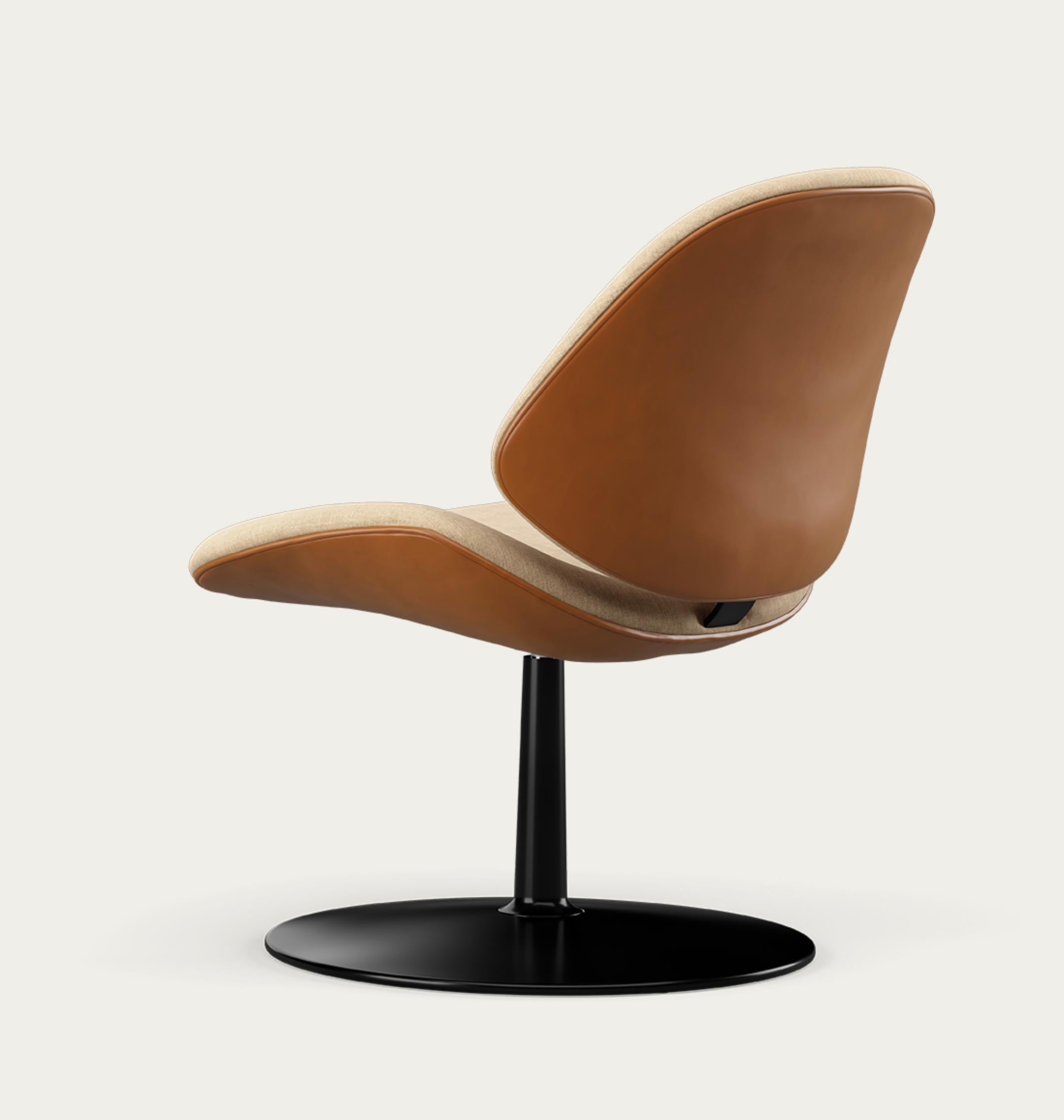Salto and Sigsgaard Council Family Lounge Chair Legs: Black, Duo Upholstery: Front: Remix 242 + Back: Nevada Cognac 
 For One Collection 

Like the other chairs in the Council Family Series, the lounge version is designed with a consideration for
