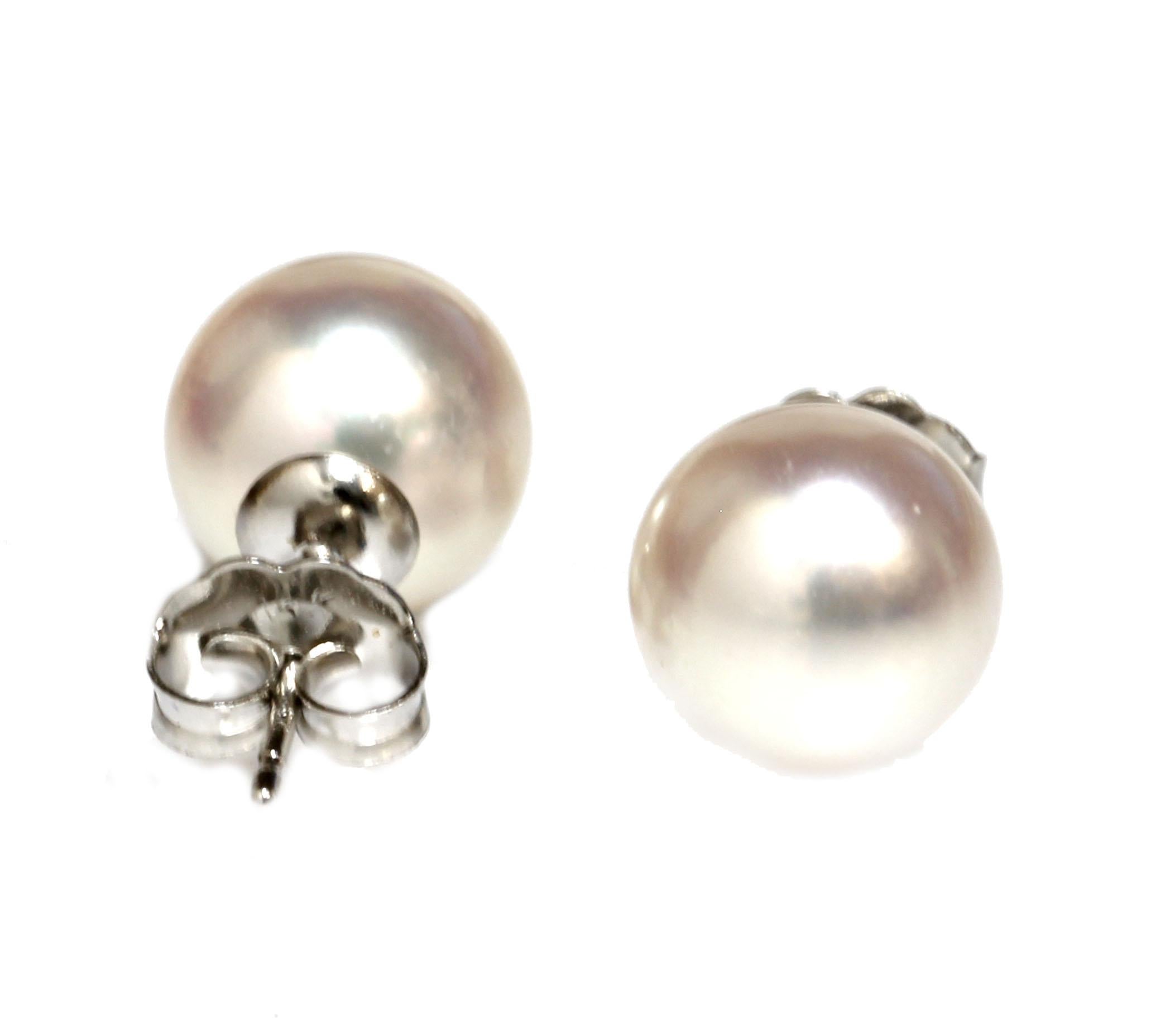 Our traditional classic saltwater akoya pearl stud earrings, the size is 9 - 9.5mm with top luster and nacre. They are flawless in surface clarity.  They are perfect round pearls with perfect classic white in color . They are set in 14k white gold