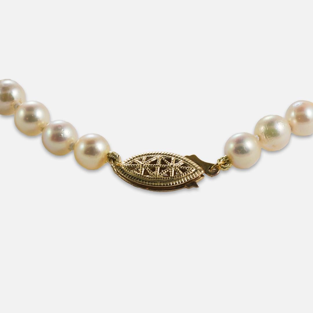 Saltwater-cultured pearls with gold-filled clasp.
The pearls measure 6.5 to 6.8mm in diameter, very good luster, light pink overtones, and some natural surface blemishes.
The strand measures 16 inches long.
Overall, excellent condition.