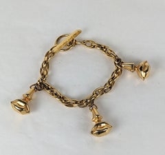 Salvador Dali Aphrodite Surrealistisches Anhänger-Armband mit Knopfleiste