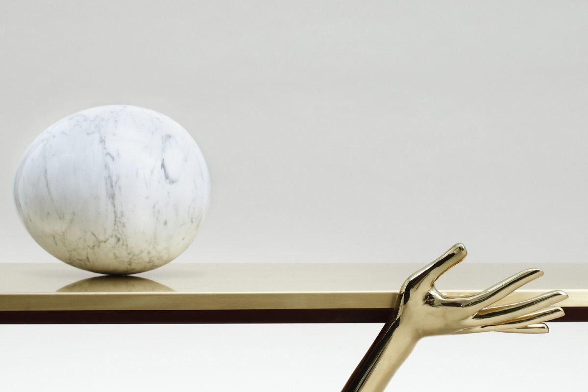 Leda low table designed by Dali manufactured by BD.

Legs are in a cast varnish brass.

Tabletop in brushed and varnished brass.
Carrara marble egg on top.

Measures: 51 x 190 x 61 H.cm

During the 1930s in Paris, Salvador Dalí surrounded himself