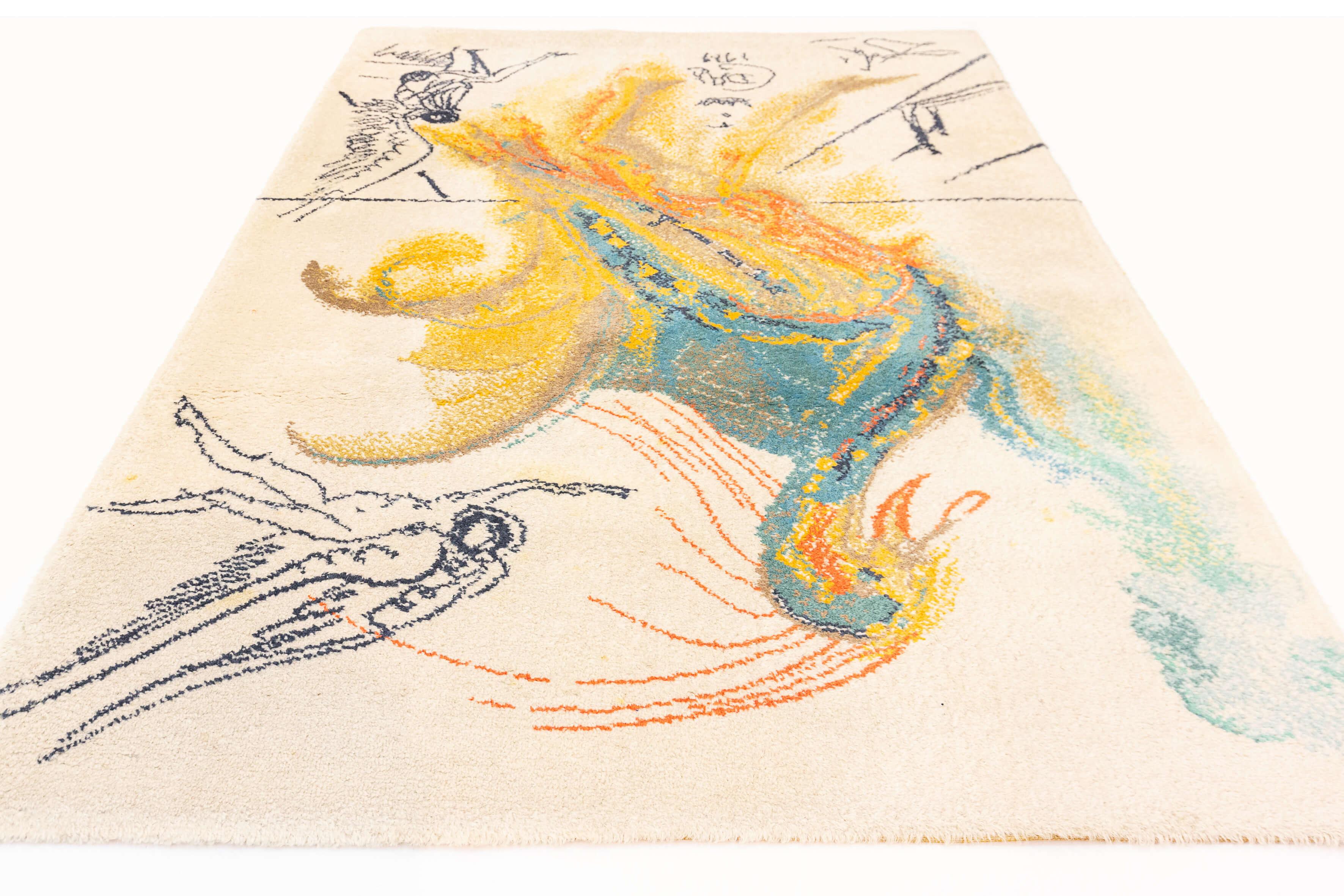 This is a mid-century rug featuring artwork by Salvador Dalí, the renowned Spanish surrealist artist. The piece is a representation of Dalí's unique and fantastical style, depicting an abstracted, colorful phoenix-like creature in the midst of a