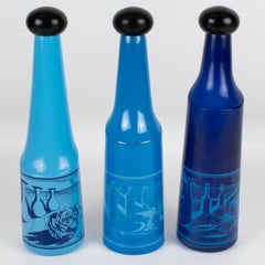 Salvador Dali für Rosso Antico, blaue Glasflaschen, ein Trio, um 1970