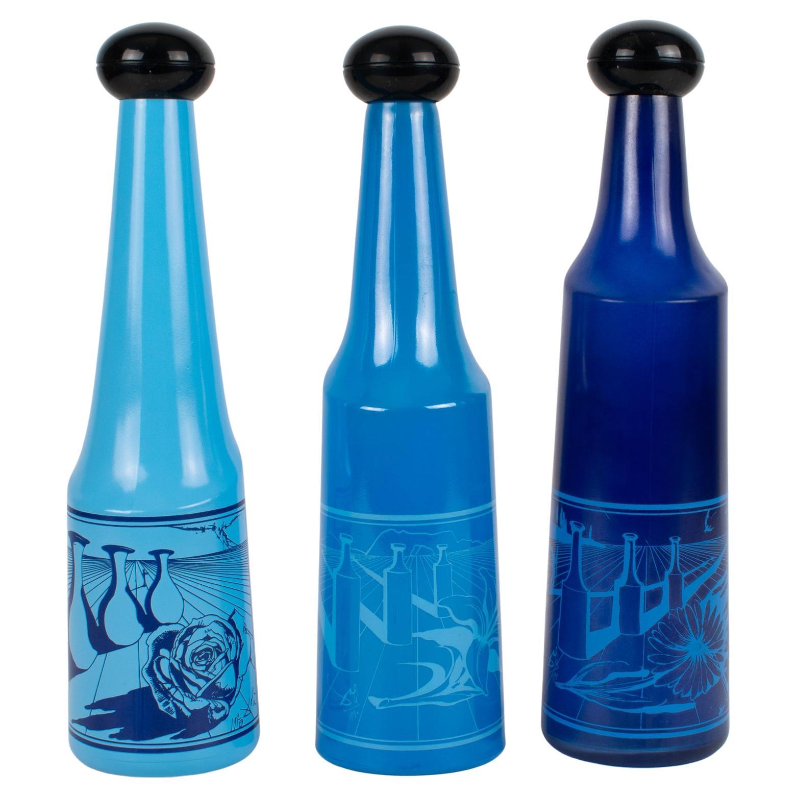 Salvador Dali for Rosso Antico, Blue Glass Bar Bottles, a trio, circa 1970 For Sale