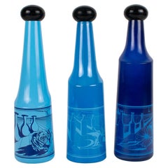 Salvador Dali for Rosso Antico, Blue Glass Bar Bottles, a trio, circa 1970