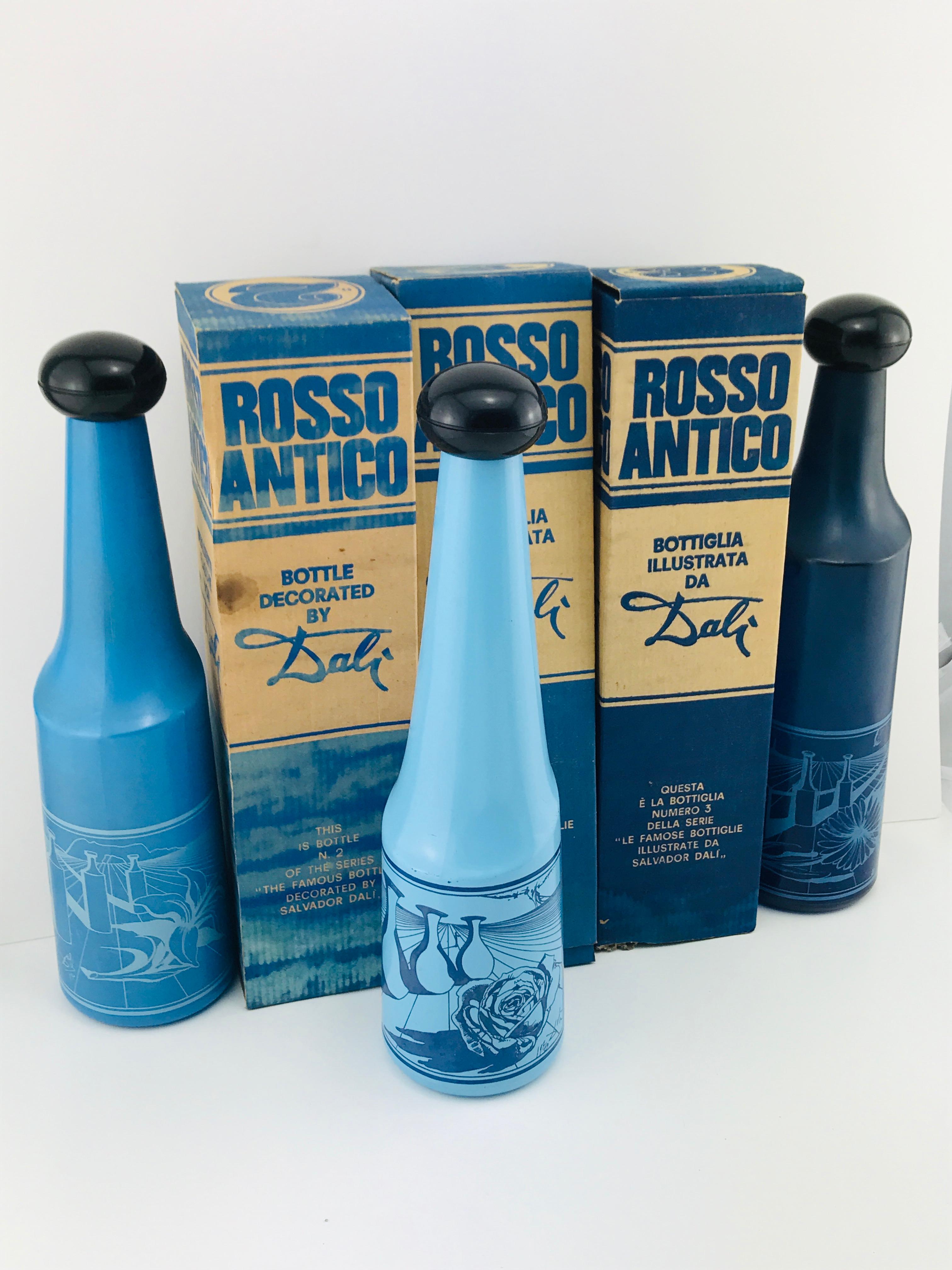 Excellent vintage condition original stoppers in tact
Beautiful succession of blue color light to dark
Each has a different serigraphed image created by Salvador Dali
Surrealist views of vineyards focusing on flower motif for each bottle with