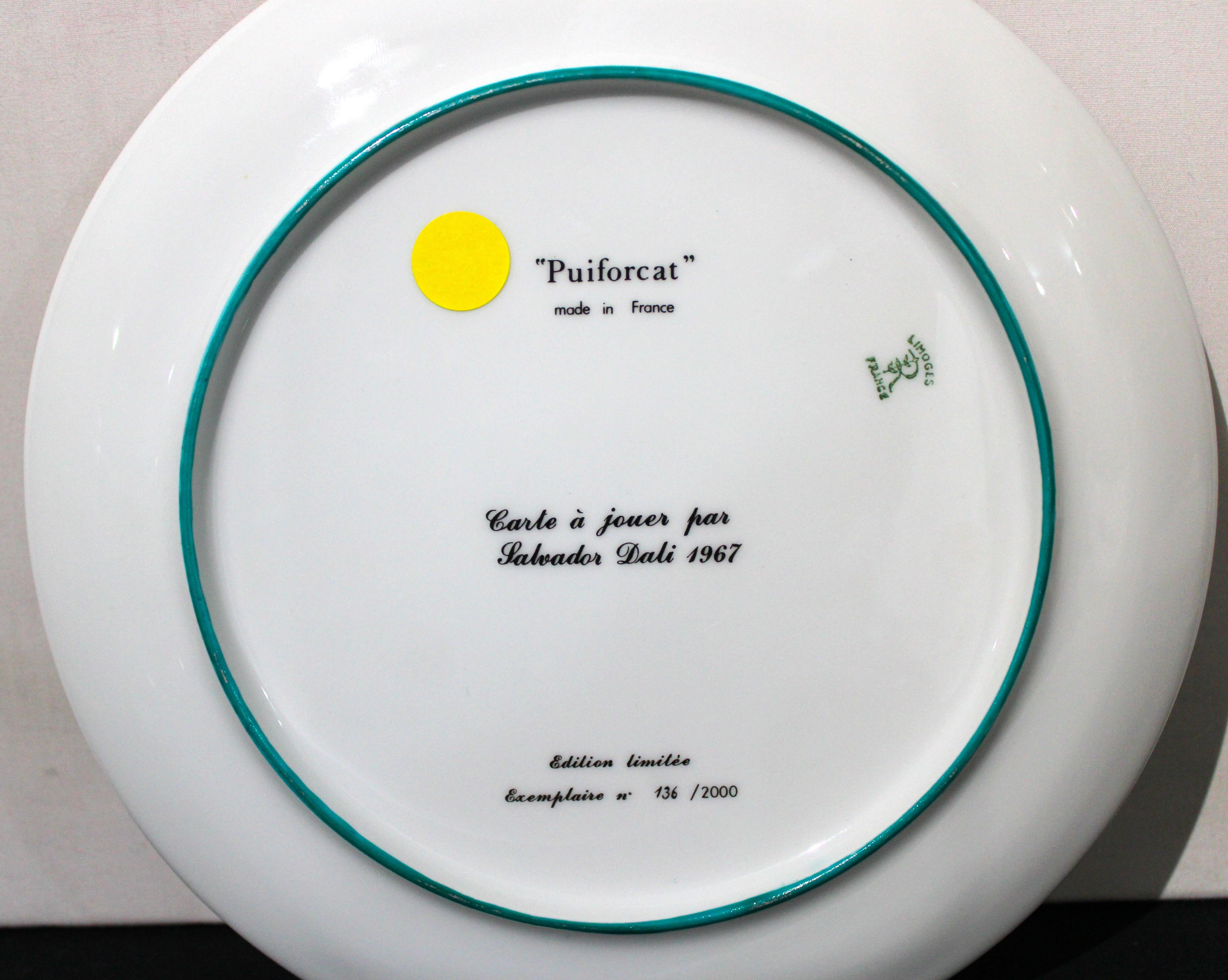 A plate from the set of five porcelain plates by Puiforcat made in France, signed by Salvador Dali. Unique design. Part of the collection from 1967 representing the Ace, King, Queen, Jack and Joker of hearts. It is marked on the reverse and made in