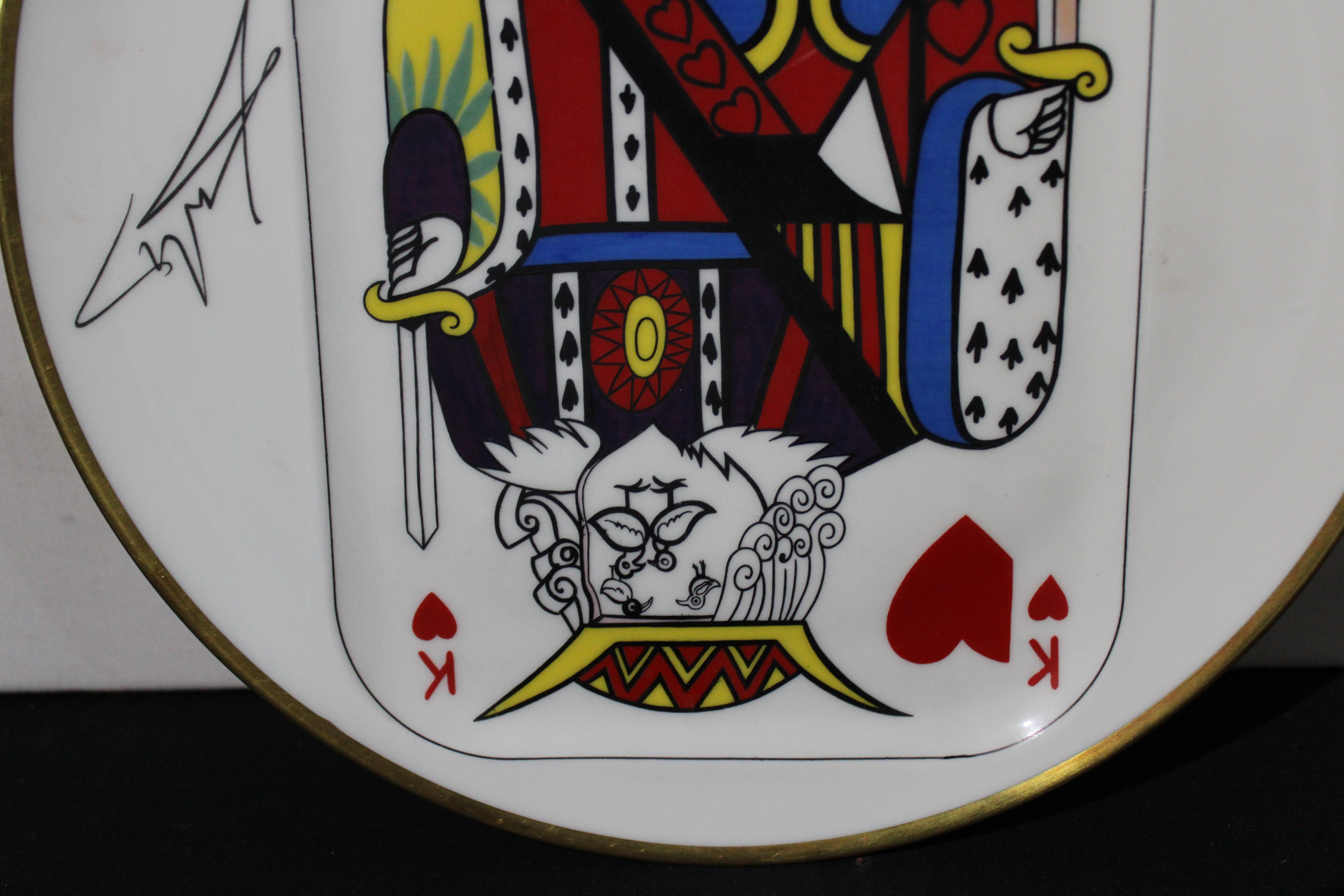 A plate from the set of five porcelain plates by Puiforcat made in France, signed by Salvador Dali. Unique design. Part of the collection from 1967 representing the Ace, King, Queen, Jack and Joker of hearts. It is marked on the reverse and made in