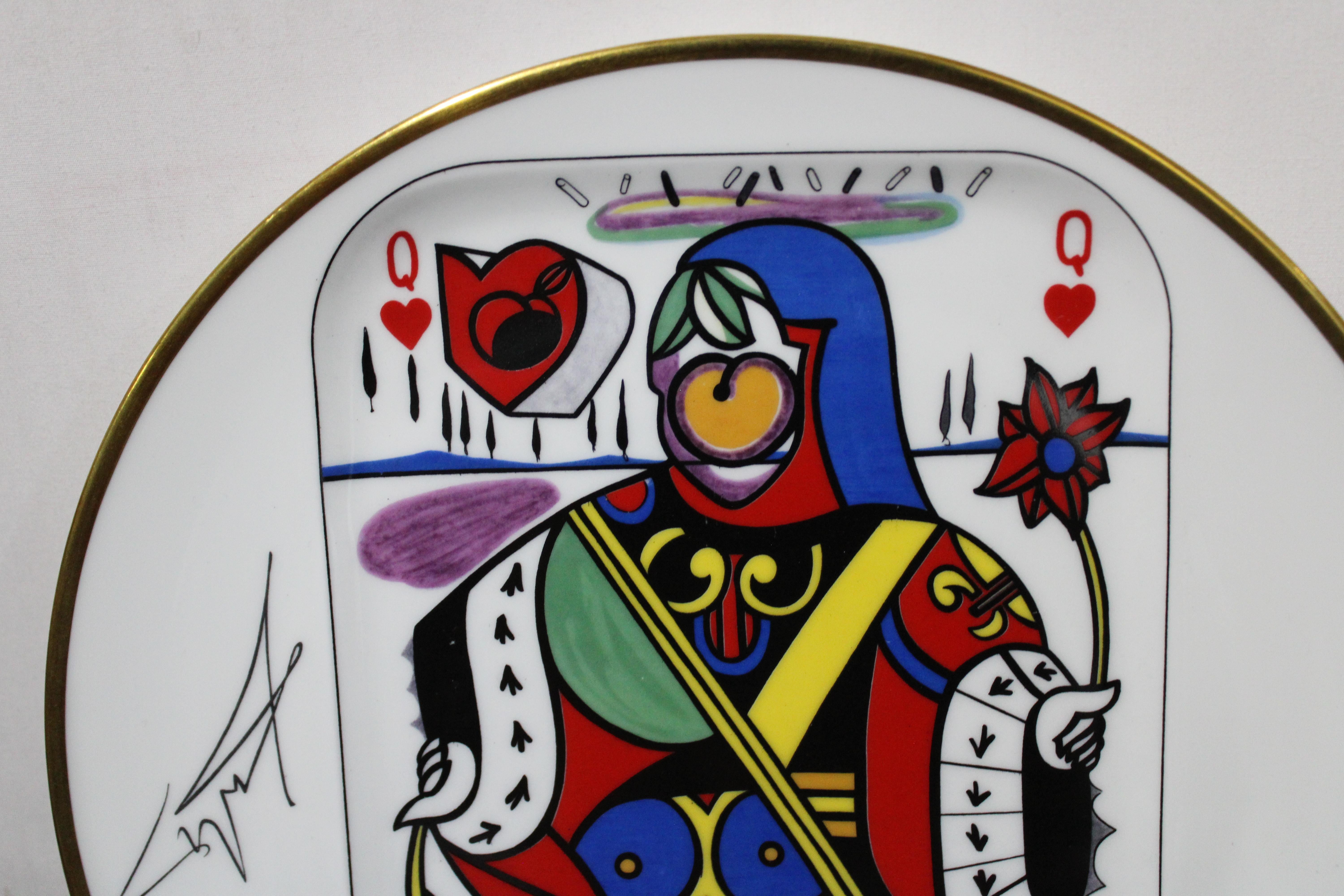 A plate from the set of five porcelain plates by Puiforcat made in France, signed by Salvador Dali. Unique design. Part of the collection from 1967 representing the Ace, King, Queen, Jack and Joker of hearts. It is marked on the reverse and made in