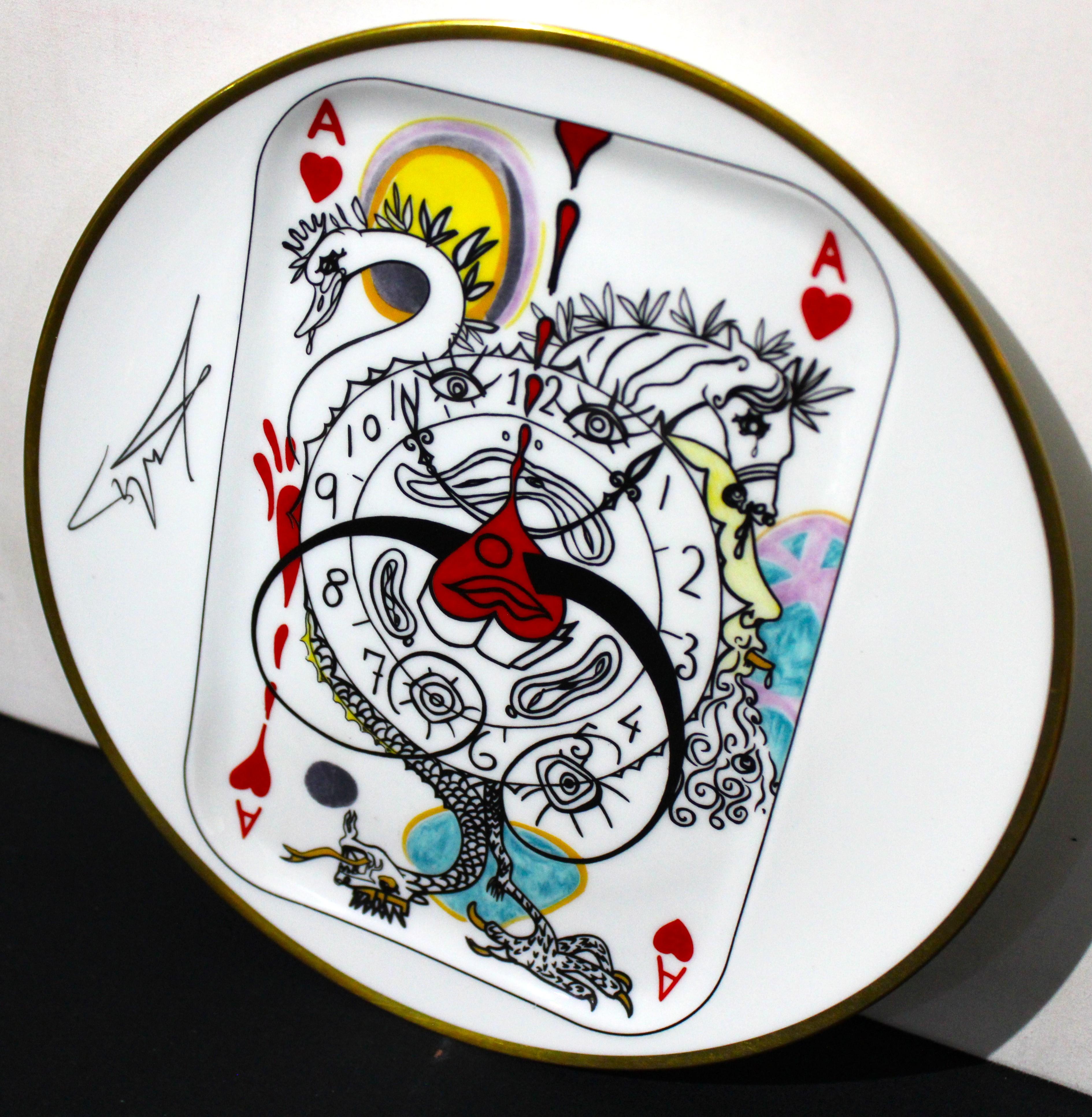 A plate from the set of five porcelain plates by Puiforcat made in France, signed by Salvador Dali. Unique design. Part of the collection from 1967 representing the Ace, King, Queen, Jack and Joker of hearts. It is marked on the reverse and made in