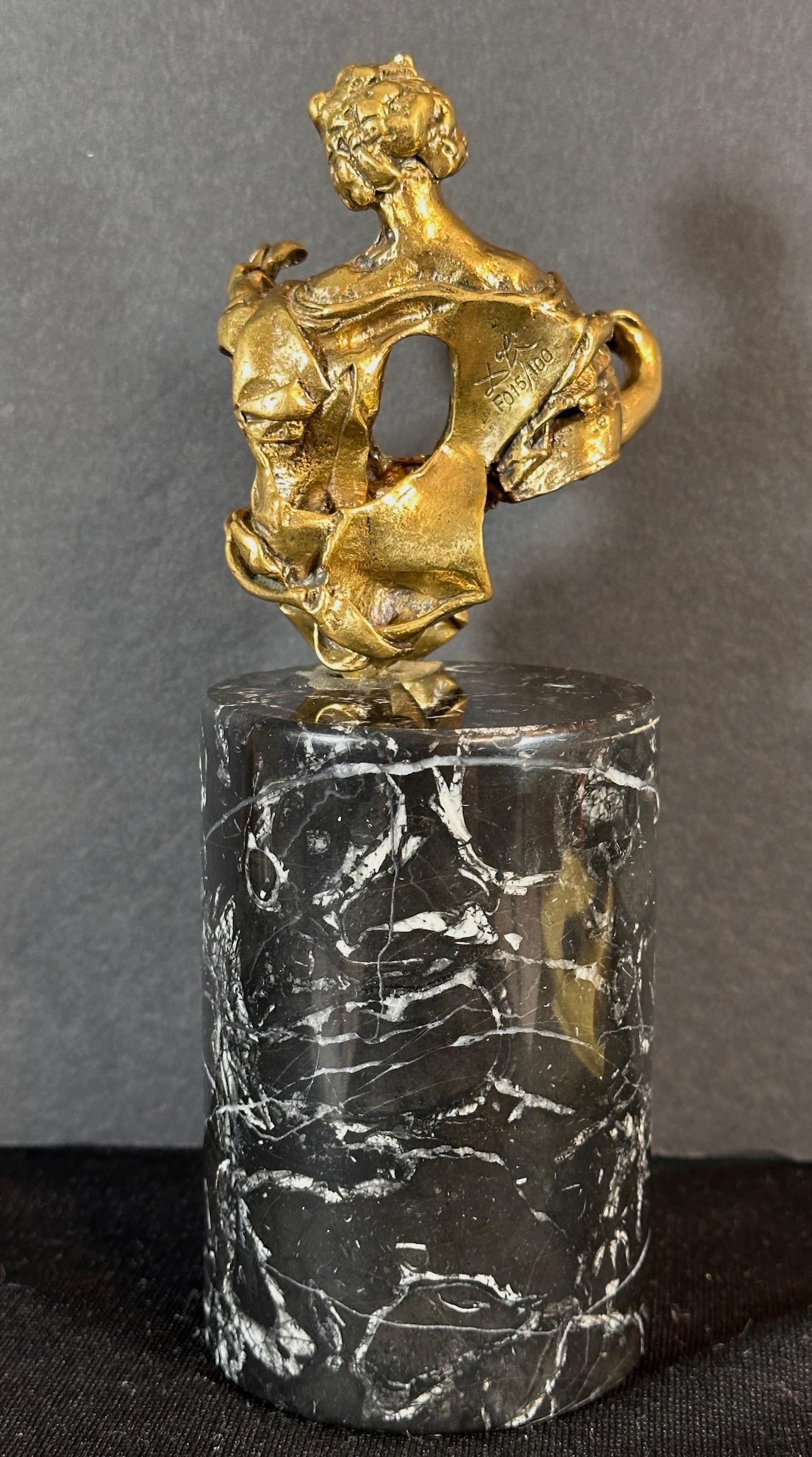 
ARTIST: Salvador Dali

TITLE: The Madonna of Port Lligat

MEDIUM: Sculpture with Bronze Patina

SIGNED: Engraved signature in the sculpture

EDITION NUMBER:  F 015/100

MEASUREMENTS: Sculpture: 4.5
With Marble Base: 9