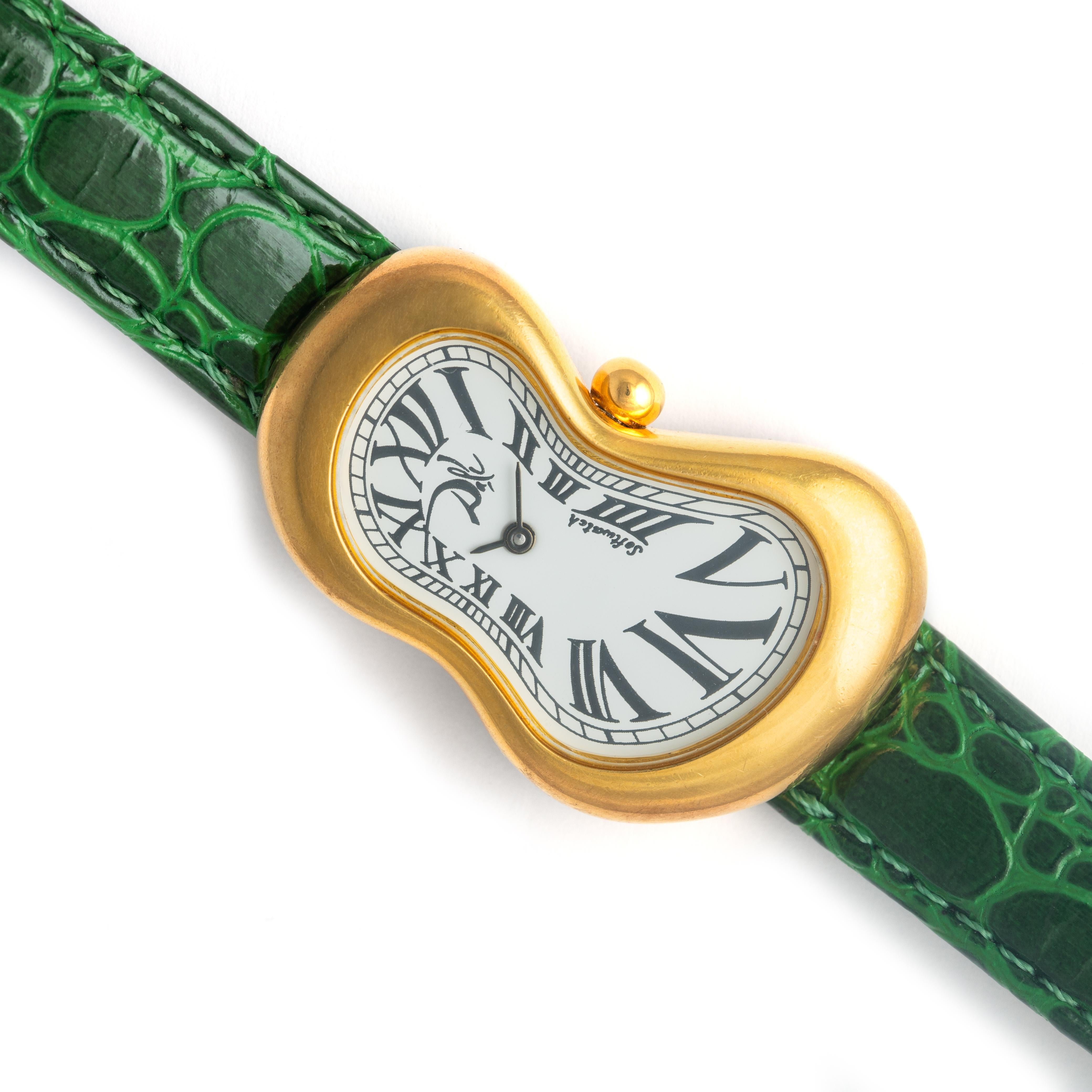 Salvador Dali Softwatch Exaequo Armbanduhr.
Quarzwerk.
Abmessungen des Gehäuses: 48,00 mm. x 28,00 mm.
Gelbes Metall. Armband aus Kunst-Alligatorleder.
Wir übernehmen keine Garantie für das Funktionieren des Uhrwerks.

Länge Armband: 19.00