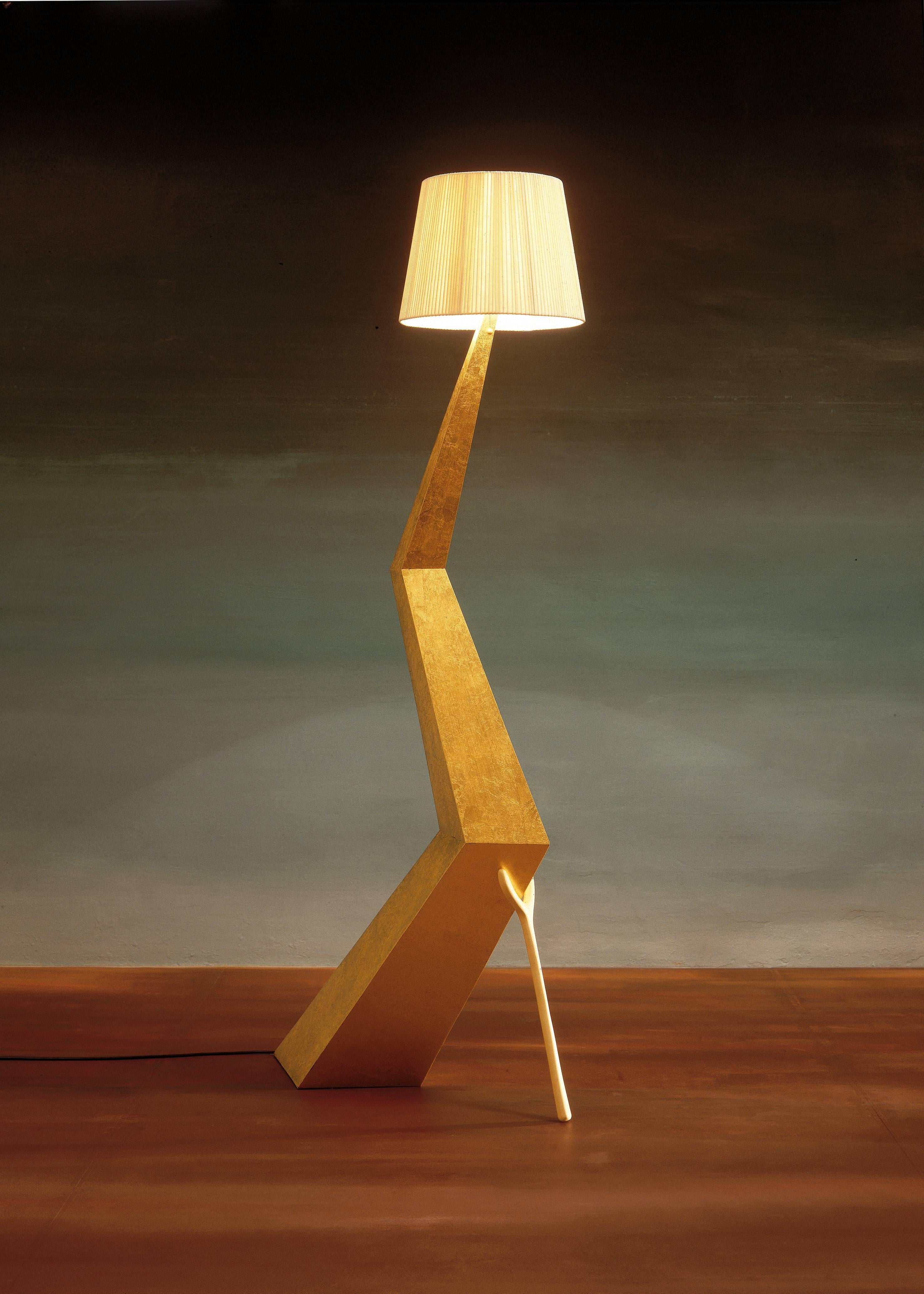 Braceli lamp designed by Salvador Dali manufactured by BD furniture in Barcelona.

Bracelli
panel structure covered with silver plated polyester painting (Fine gold leaf).
Lampshade in ivory cotton and rayon. 

Measures: 37 x 64 x 180 H.