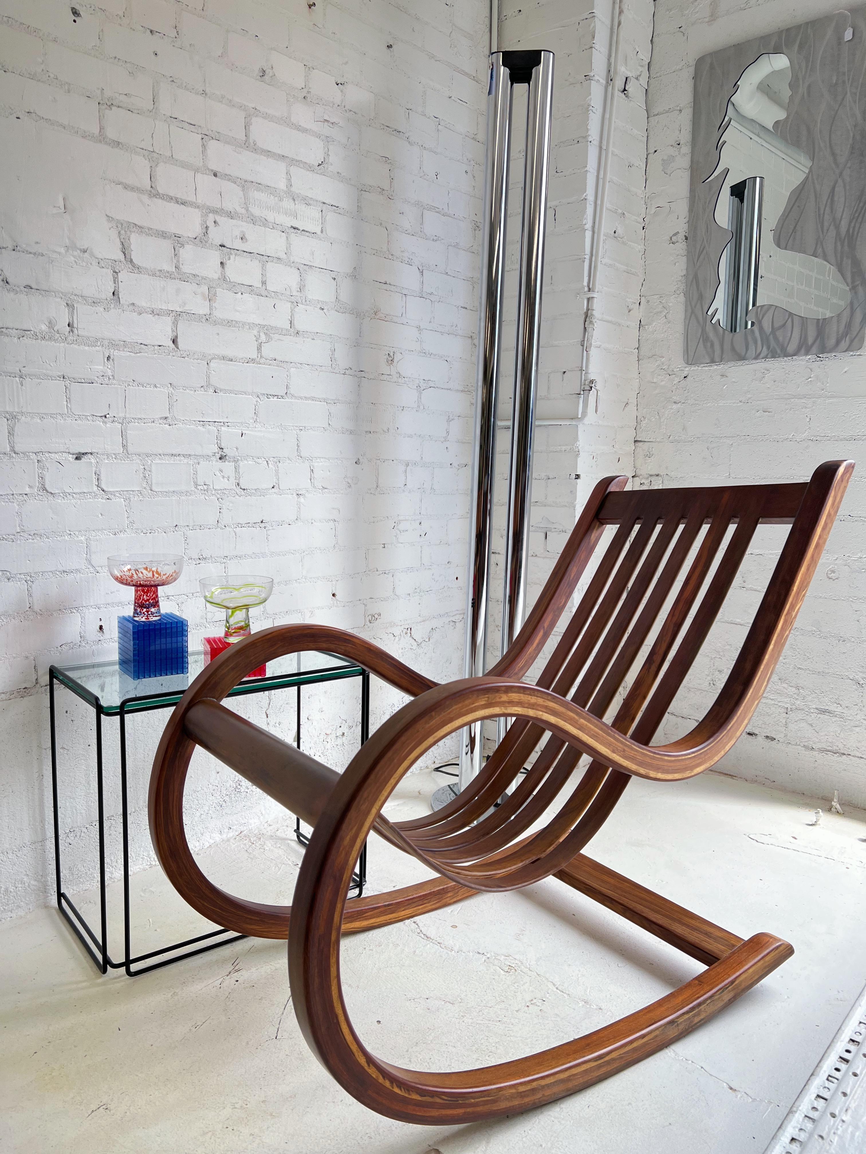 Salvador Vidal Vintage Cantilevered Rosewood Rocking Chair In Good Condition For Sale In Glendale, AZ