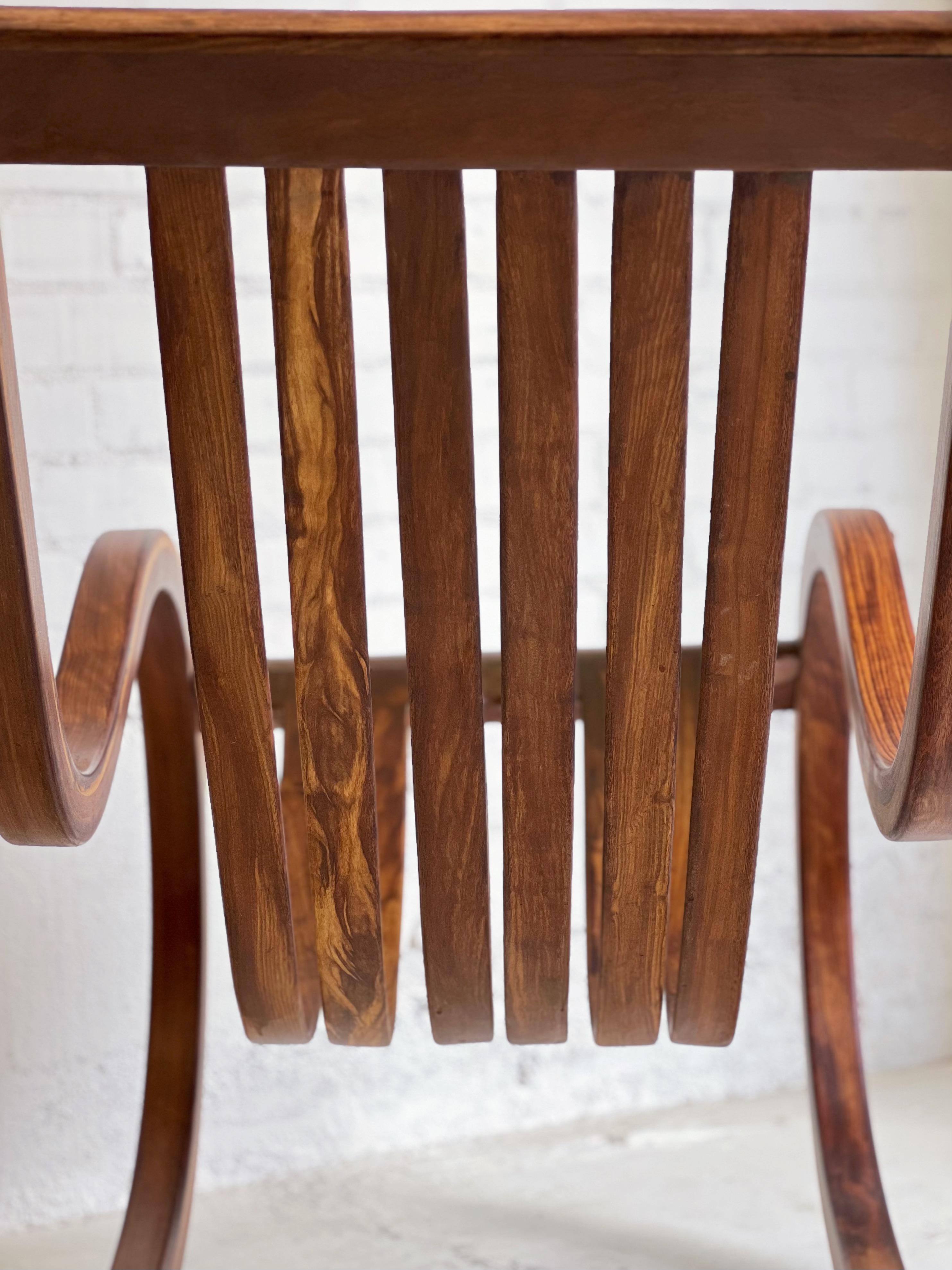 Salvador Vidal Vintage Cantilevered Rosewood Rocking Chair For Sale 1