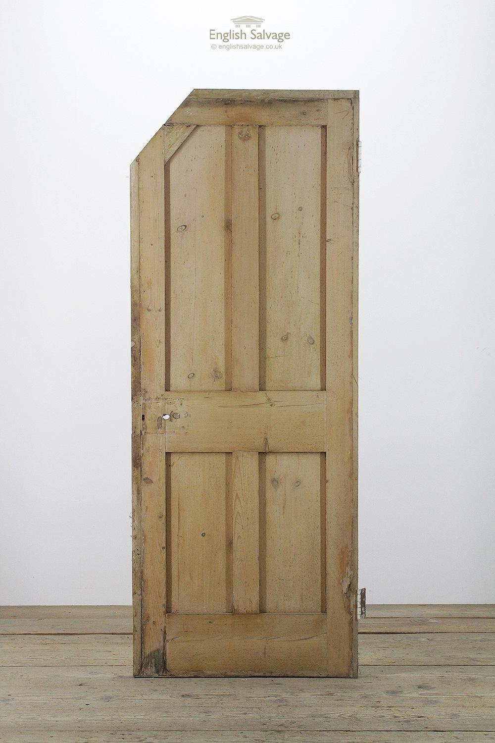 Salvaged pine four plain panel door with two hinges. The top latch side of the door has been cut and reinforced, the height to the start of the cut is 171cm and the overall size below includes strips added to the side and top of the door. Lock,