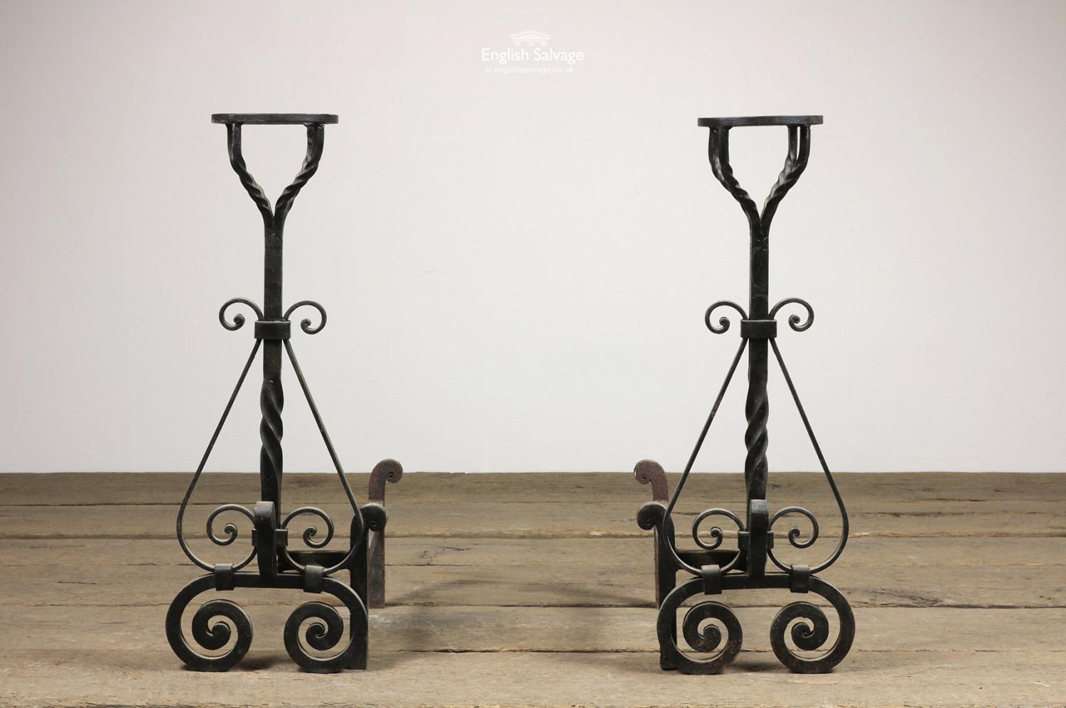 Reclaimed wrought iron fire dogs with barley twist, scroll detailing and cups. Max suitable grate depth is roughly 32cm.

Small amount of surface rust.